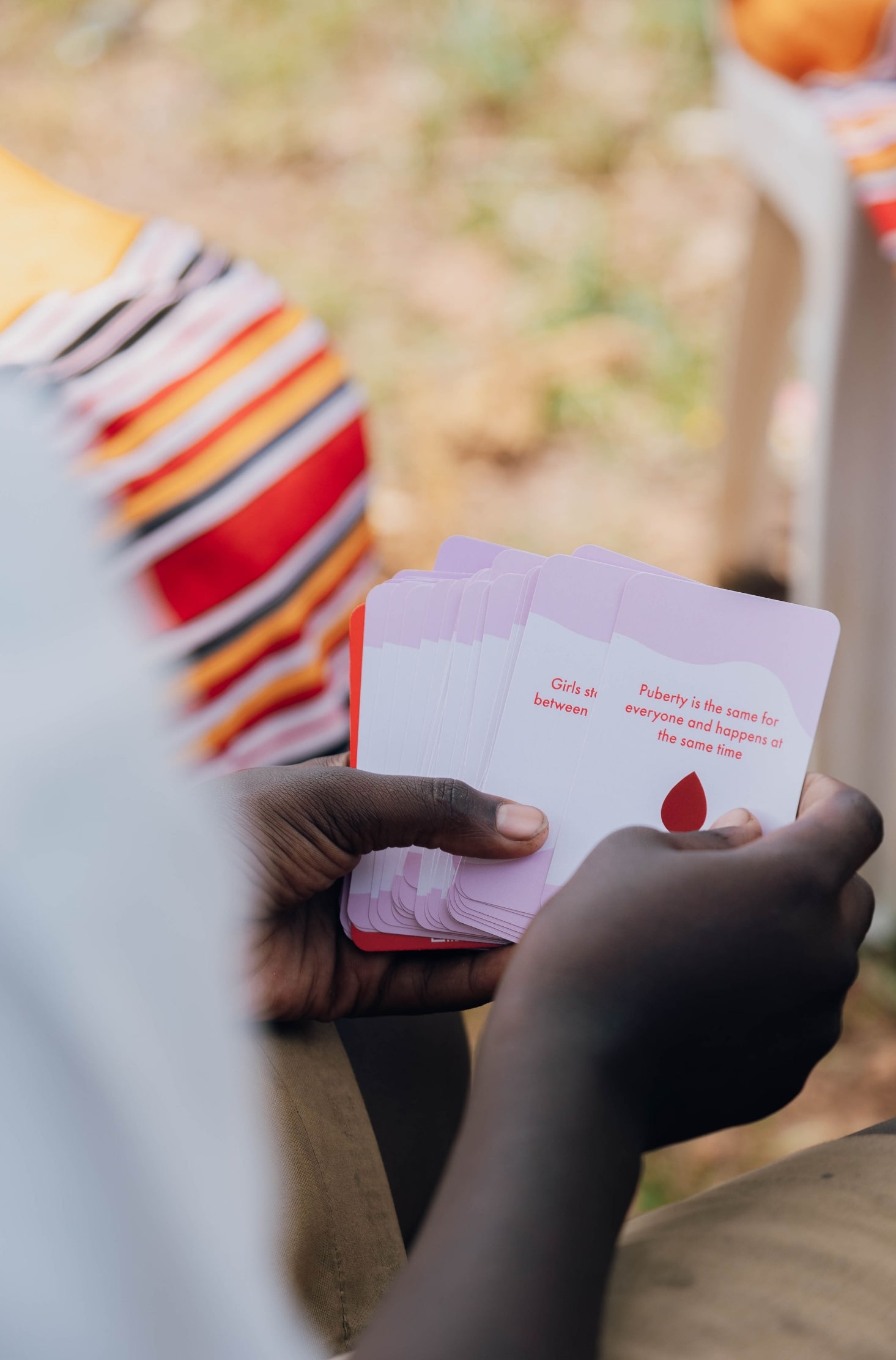 Educational card stock designed by She For She for menstrual health education.