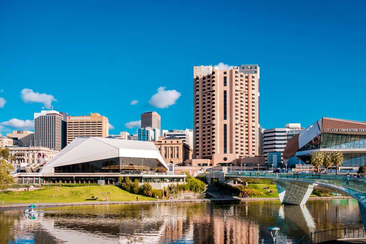 a group of cars parked in front of tall buildings