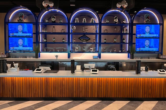 A straight on shot of the bar showing the shelving behind it