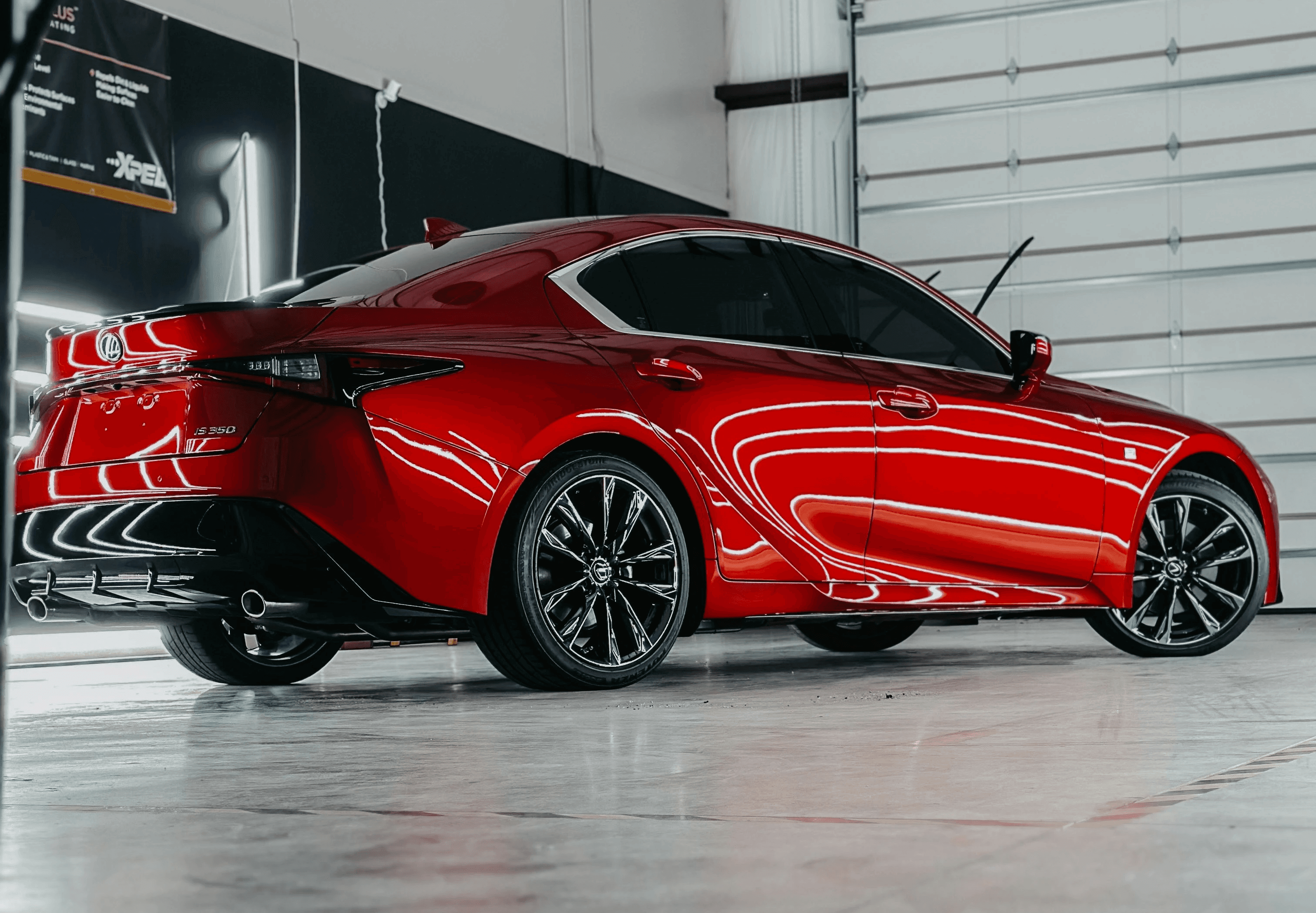 a red sports car parked in a garage