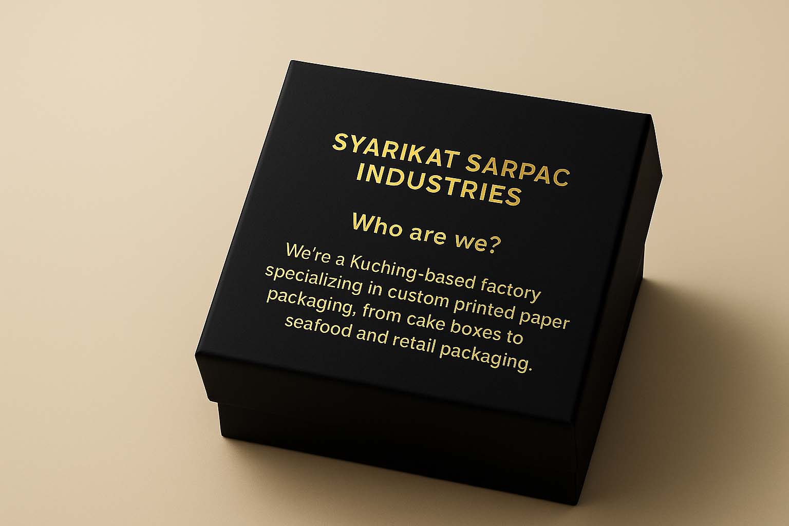 Close-up of custom black printed packaging box with gold foil text that introduces Syarikat Sarpac Industries.