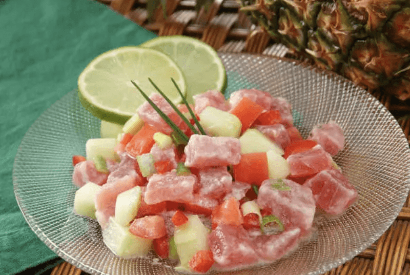 medium rare sliced steak in white ceramic plate
