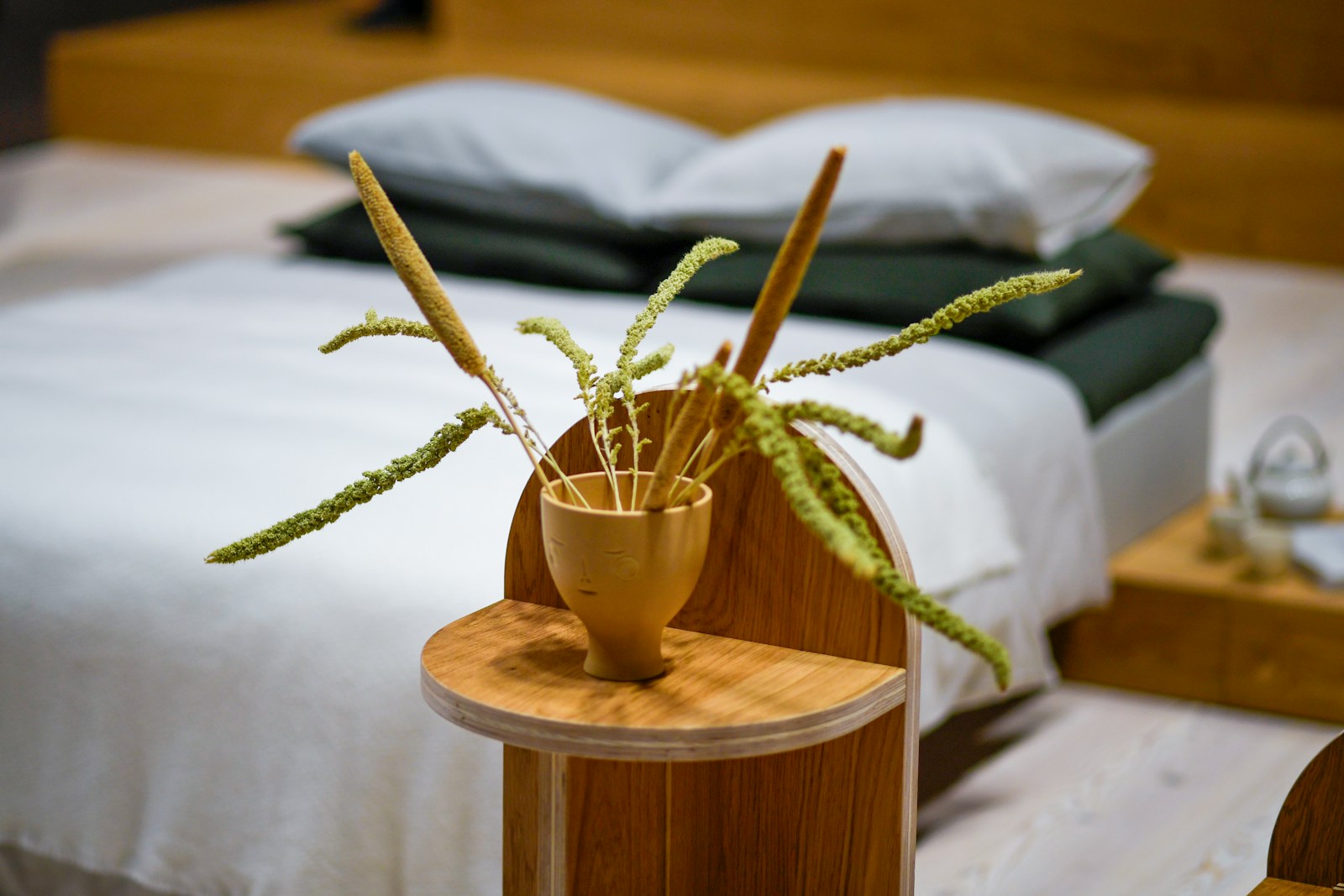 Natural bedroom detail with organic textures and warm wood