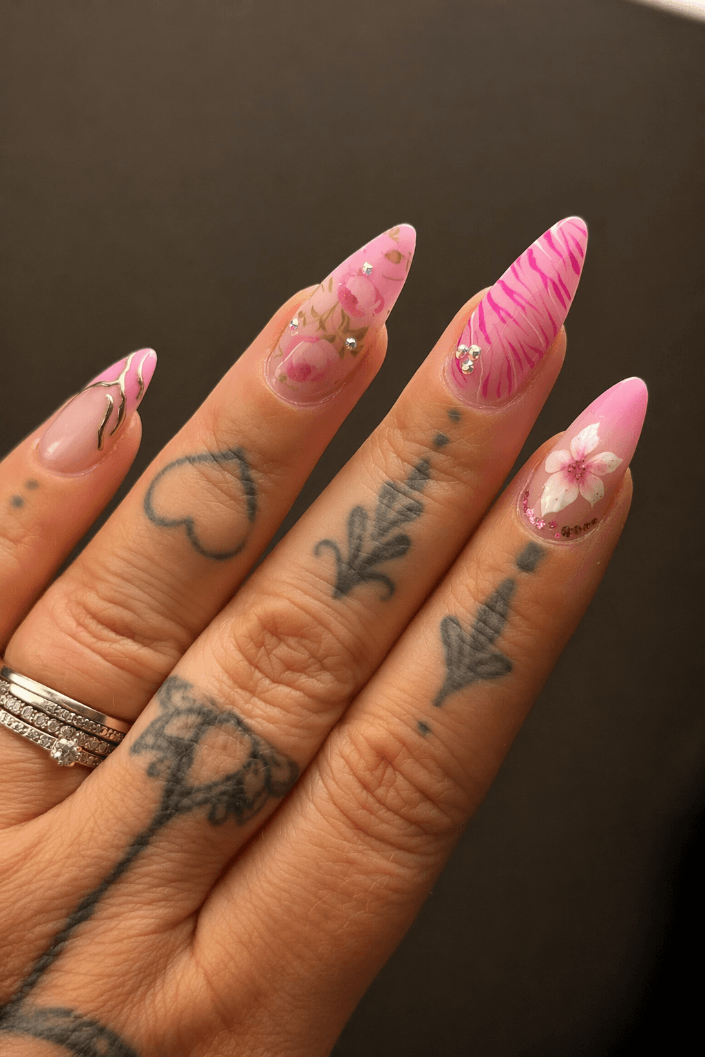 A cluttered dining table with plates, glasses, and food remnants, illuminated by soft, warm lighting.
