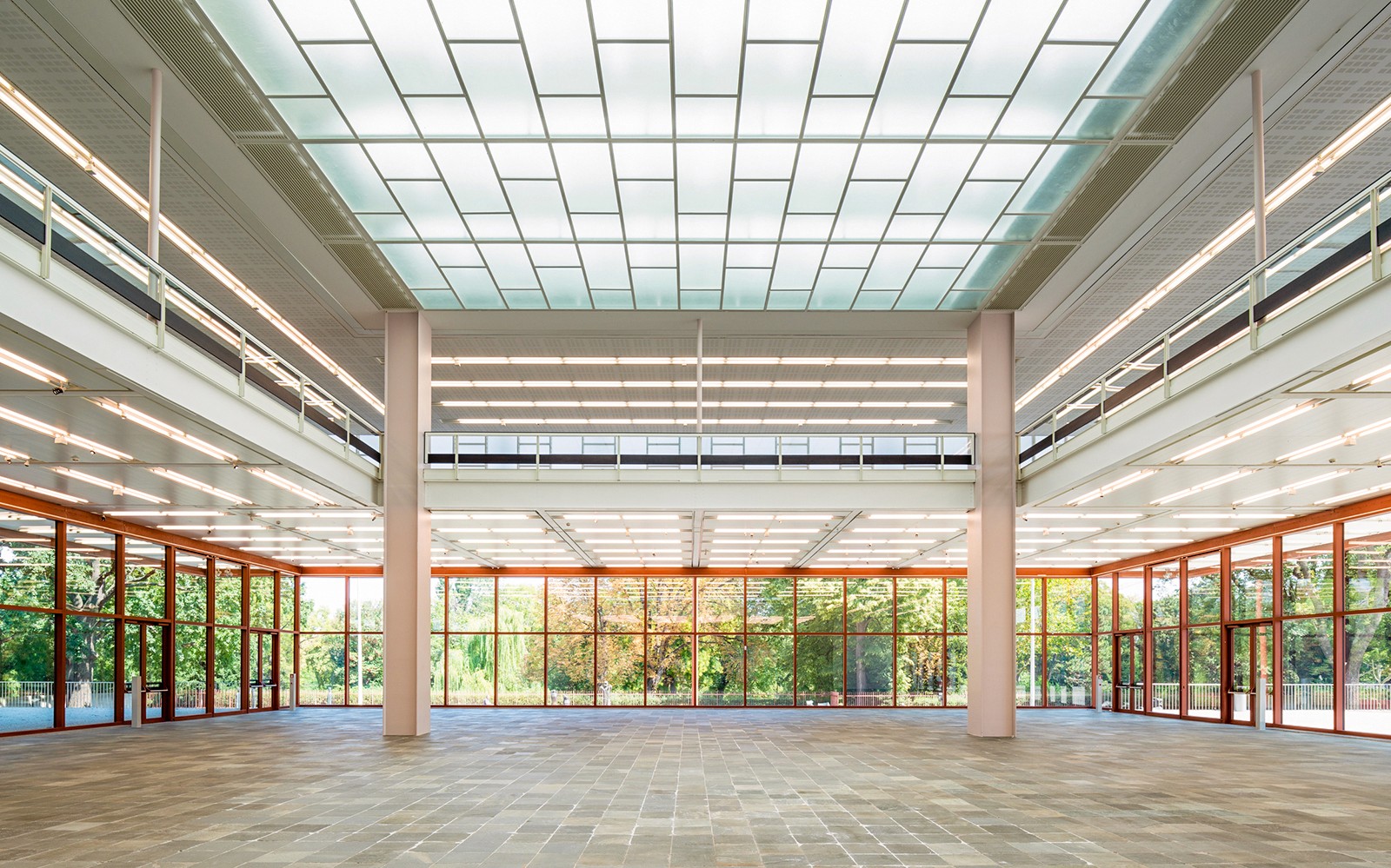 Spacious interior of Belvedere 21 Museum of Contemporary Art with large windows and modern design.