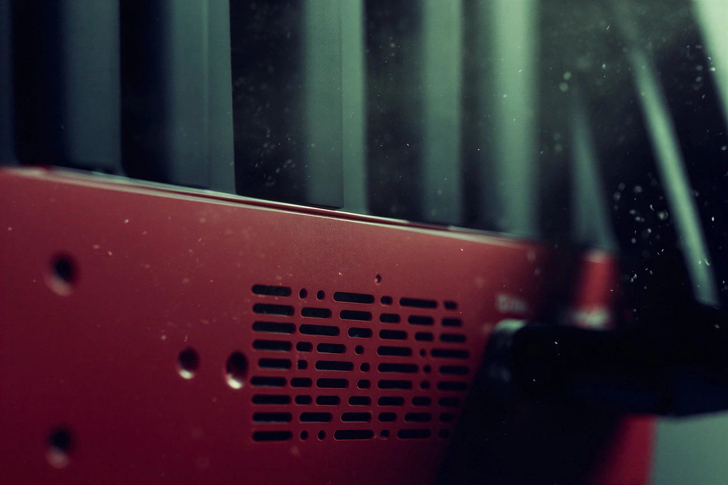 Video production team with close look of MR·NET cellular bonding gateway working with professional broadcast equipment in dynamic outdoor setting