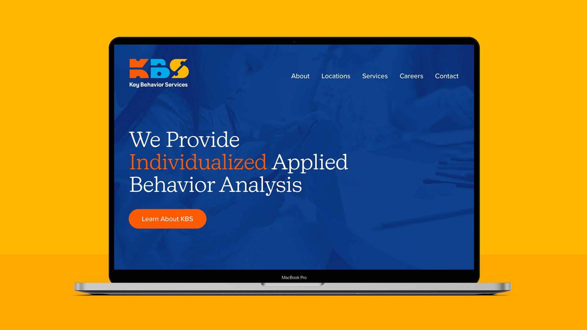 Laptop showing Key Behavior Services website: Applied Behavior Analysis.