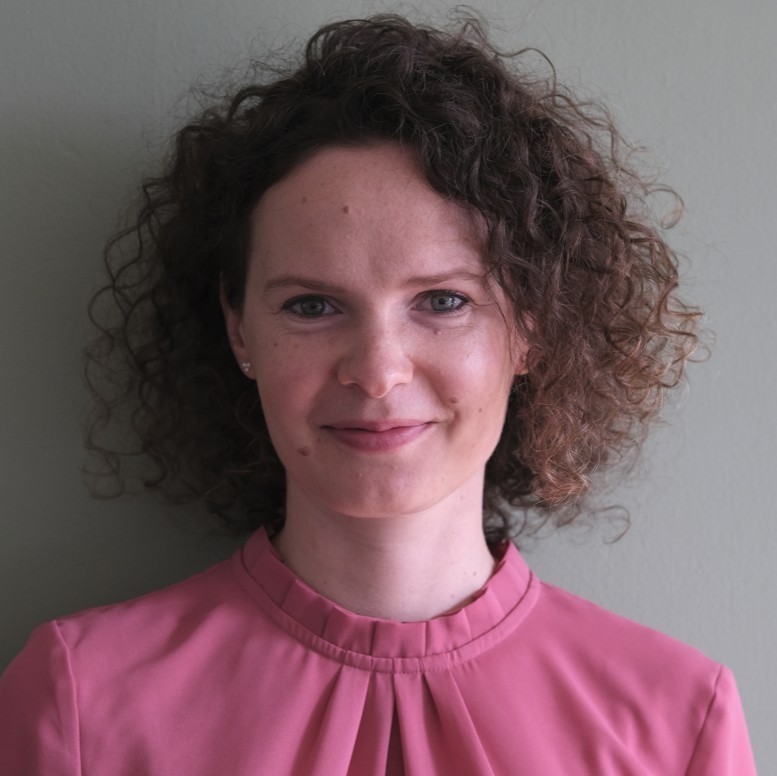 Copywriting sitting at table and smiling