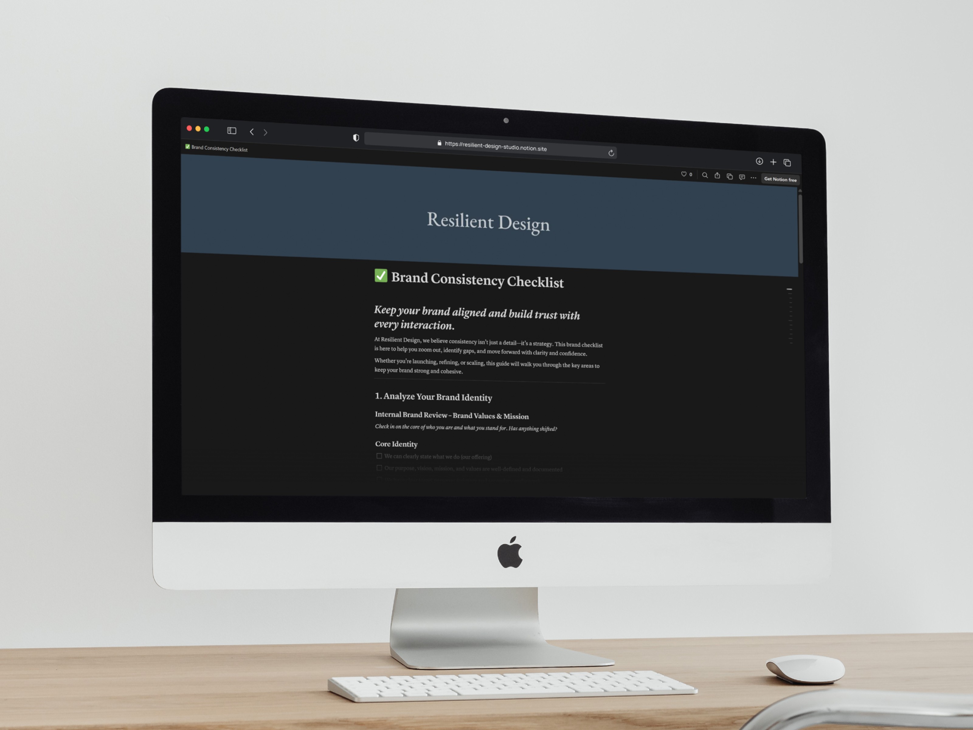 A mockup of an iMac displaying a brand checklist on Notion