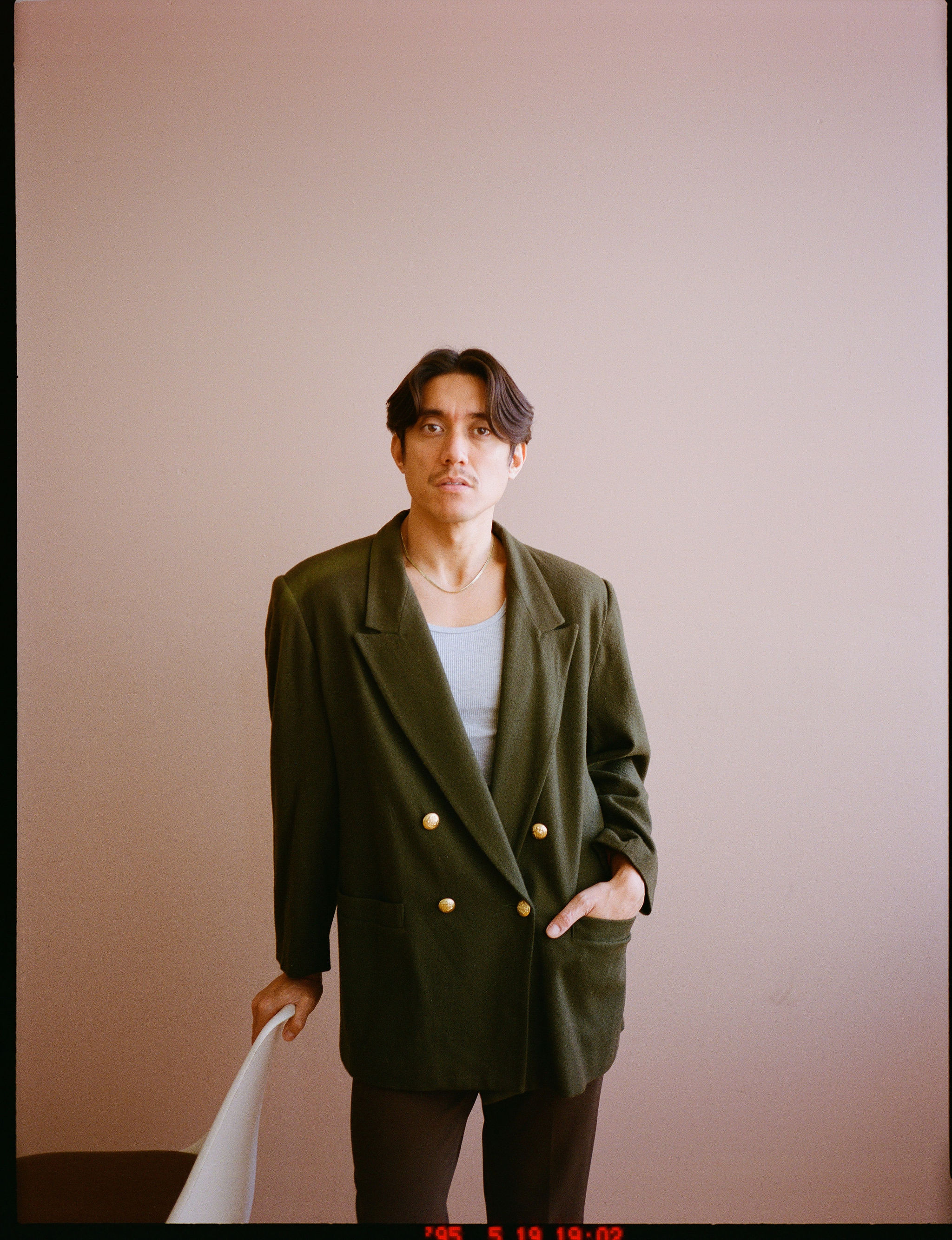 Woman with red hair covering mouth with hair