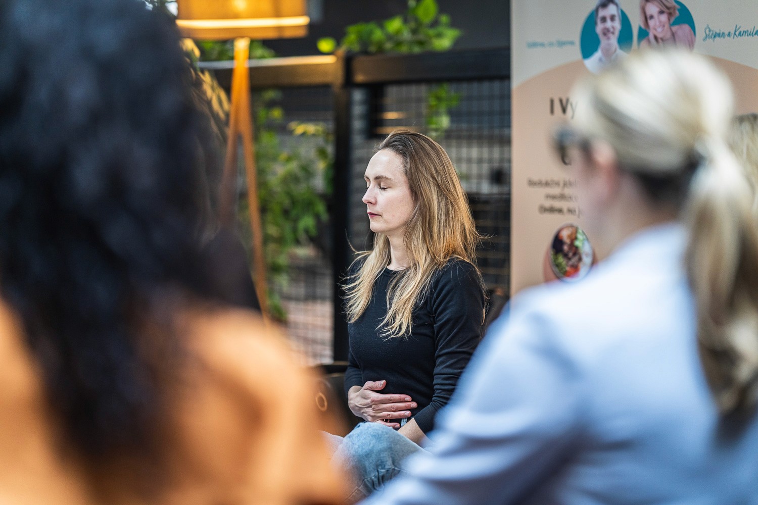 Guided meditation or mindfulness workshop taking place during a conference session.