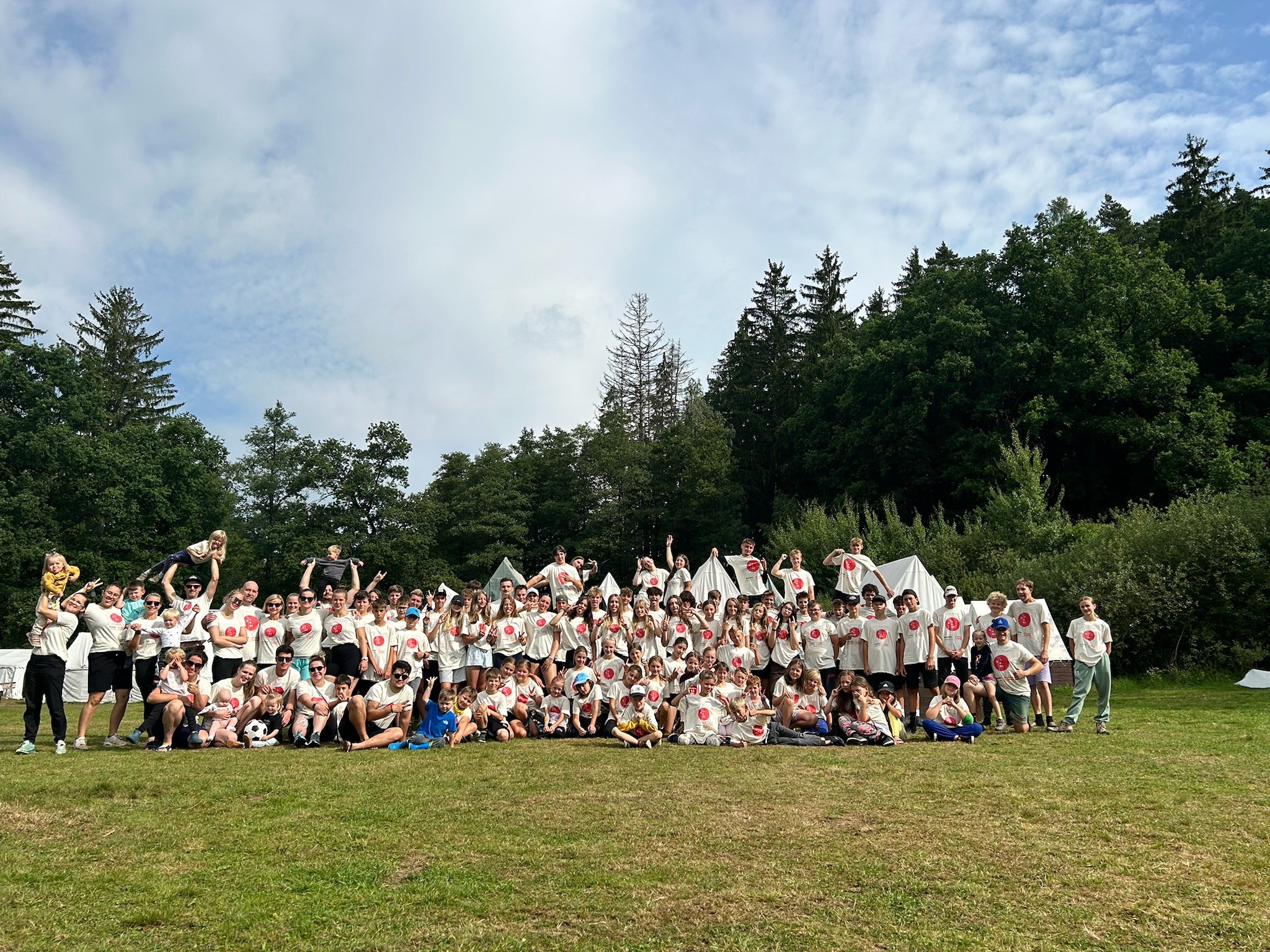 woman holding a phone and man looking at the phone. both are smiling