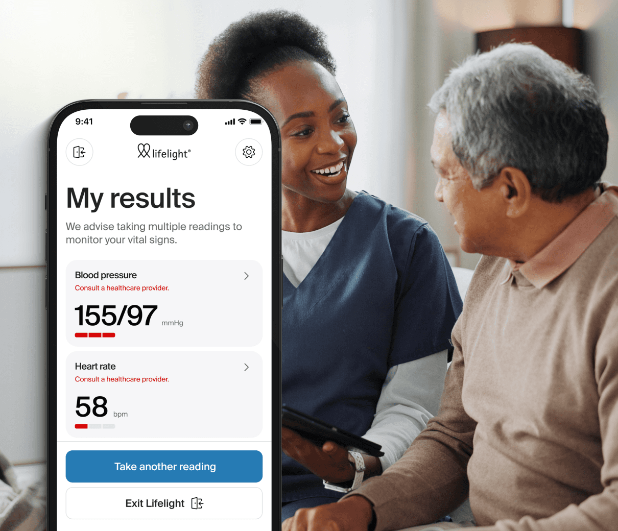 Nurse and elder male patient talking. A phone displaying poor blood pressure results on the Lifelight app, in front of them.