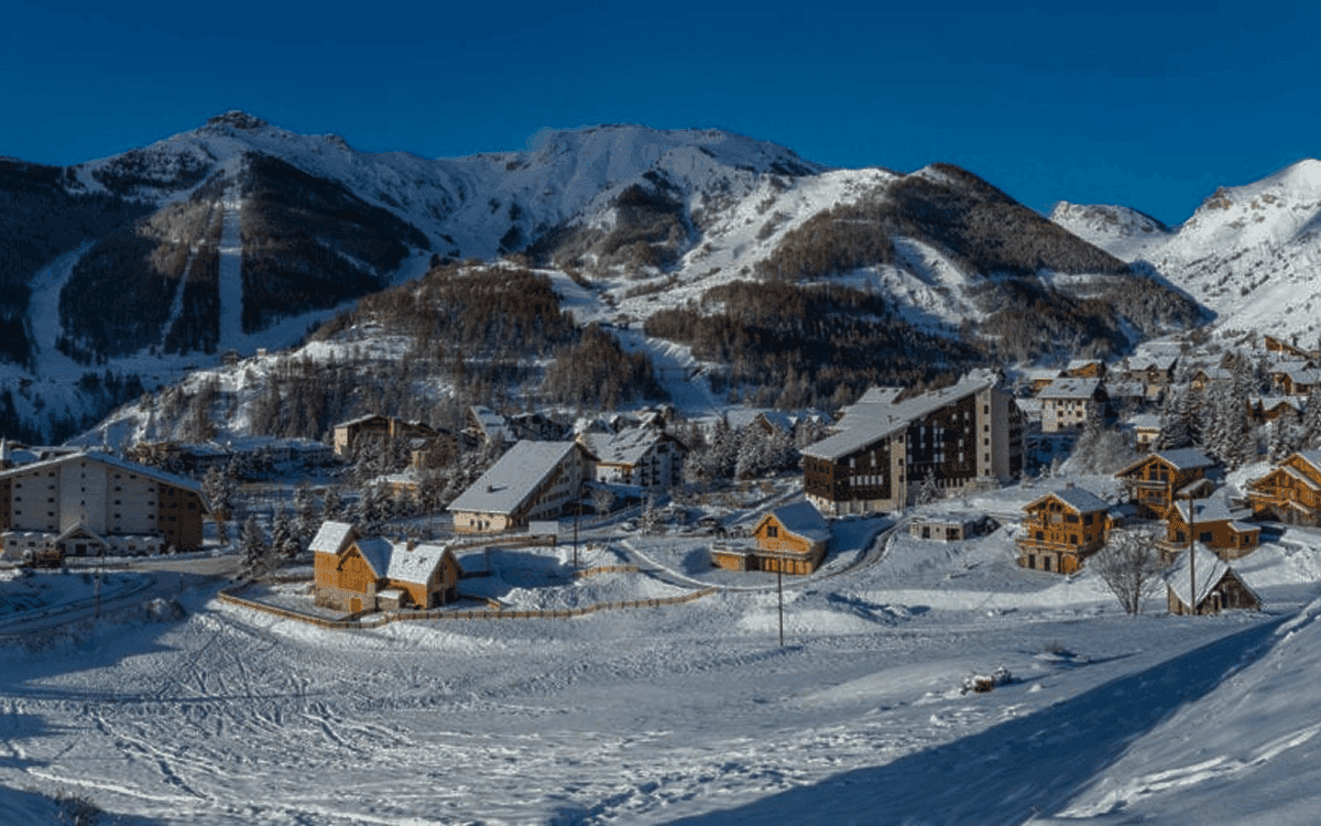 a wooden dock sitting next to a large body of water