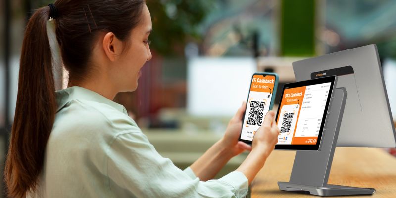 A F&B customer scanning the QR Code on a StoreHub POS system to claim her rewards