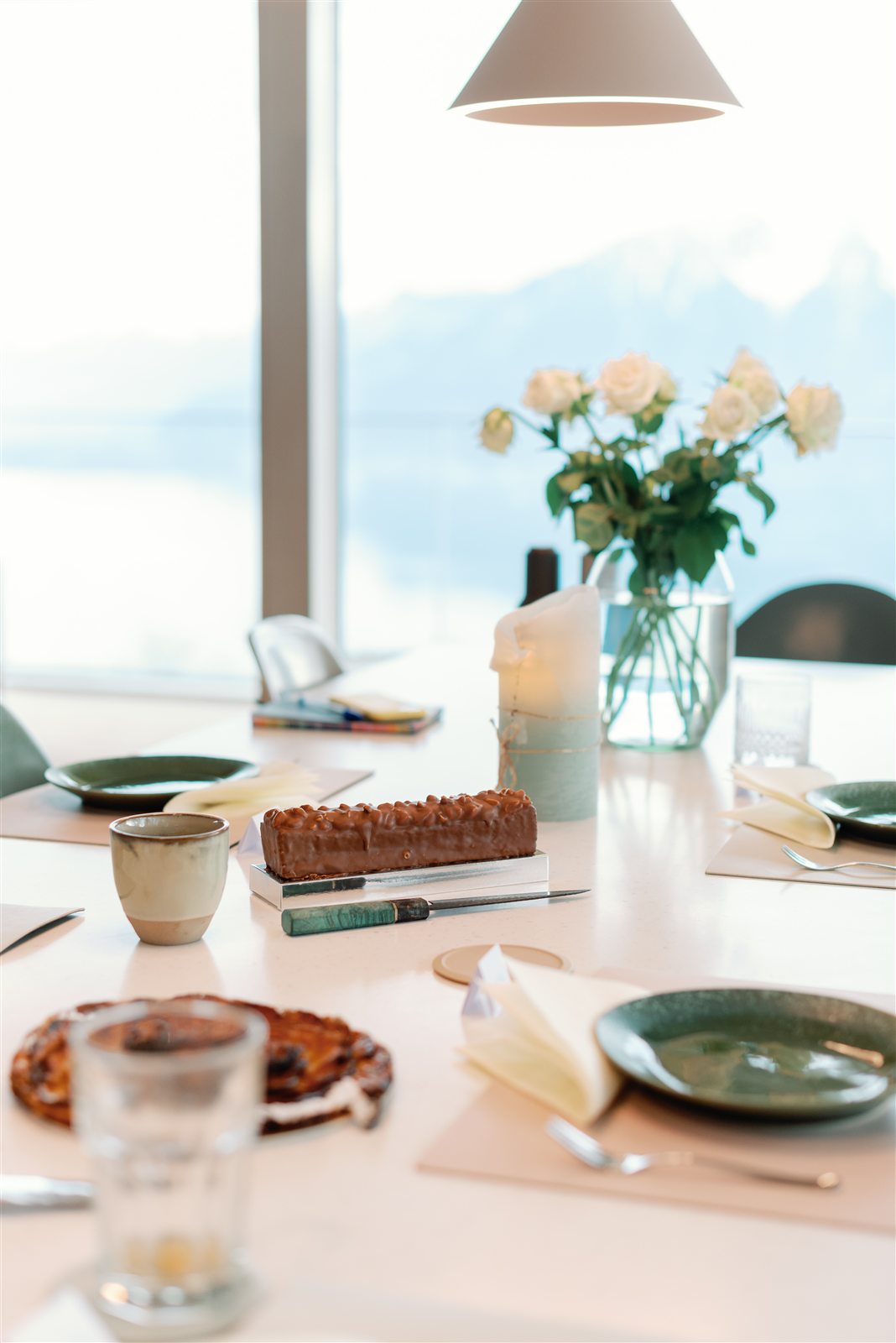 Dessert on the table with the lake behind