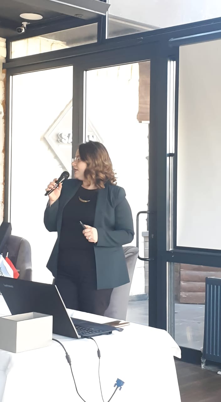 Close-up of a tree stump showing growth rings and a textured brown wood surface.
