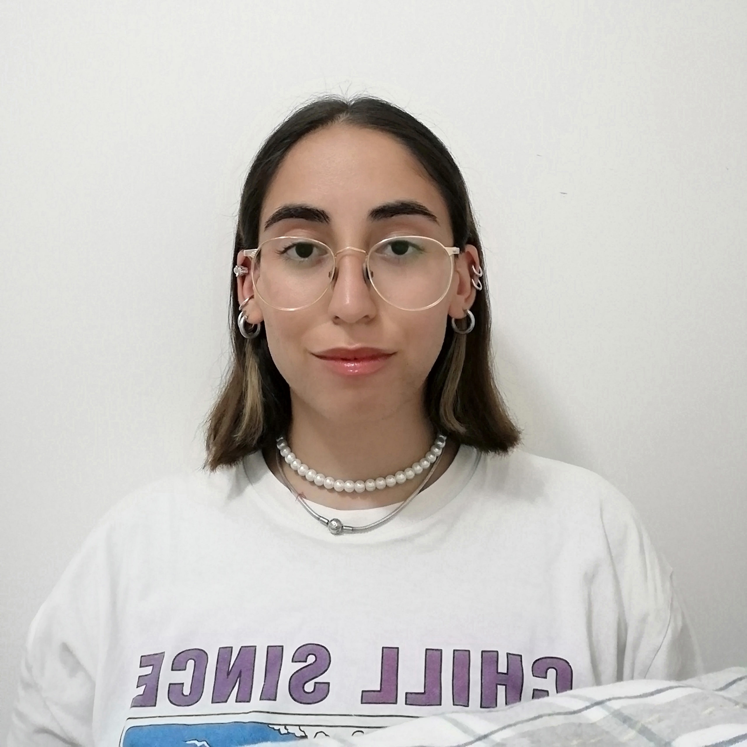woman with short hair and glasses