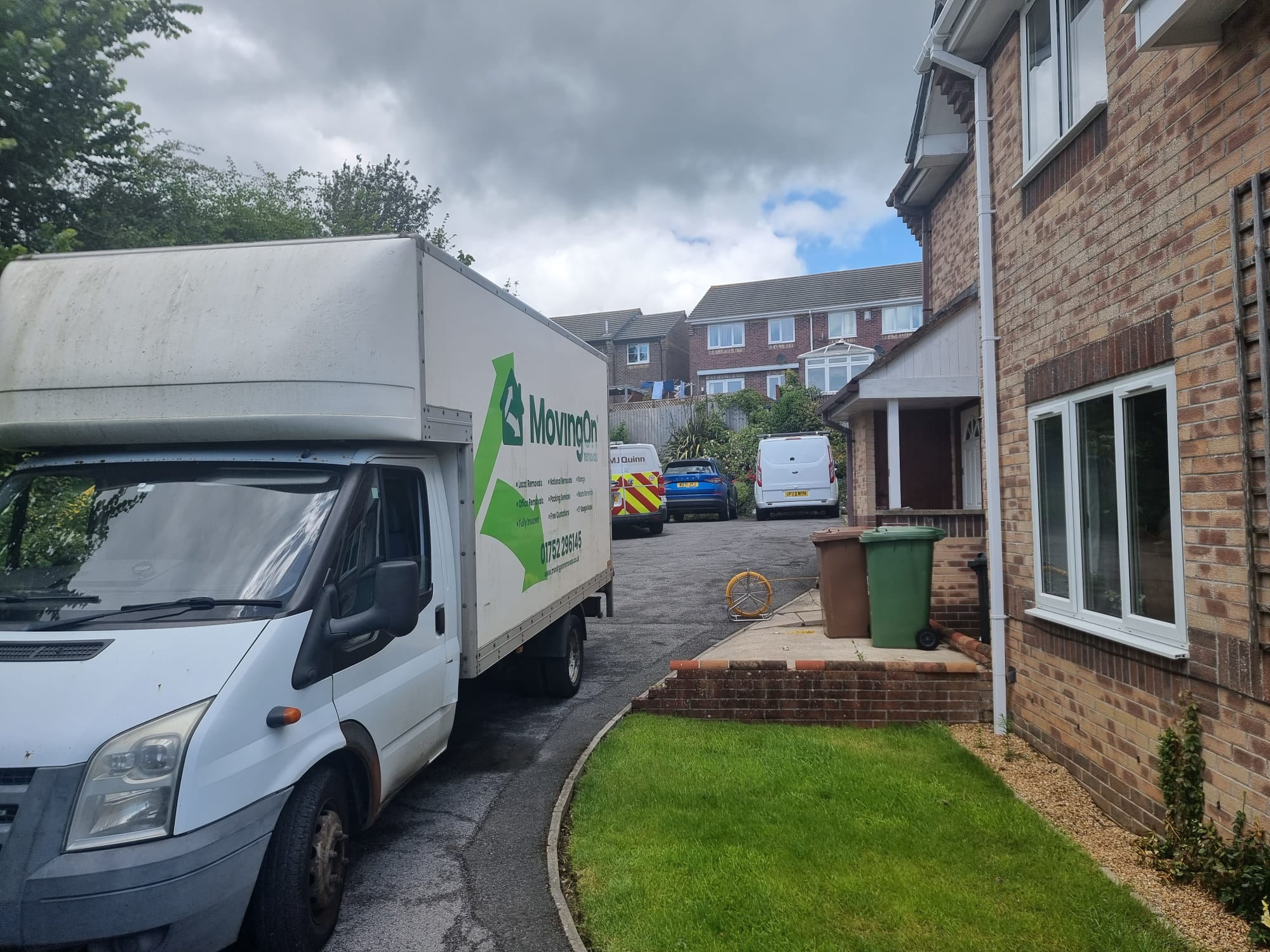 A Moving On Removals van parked outside a brick residential property during a house move from North Prospect to Plymstock.
