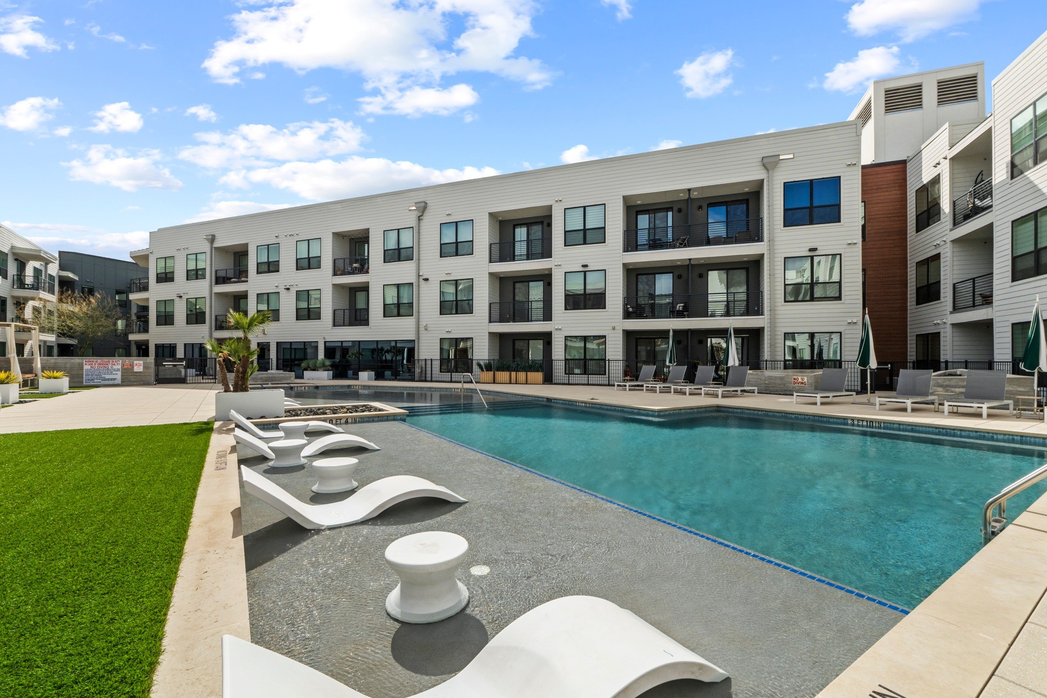 A shared pool is a common perk of owning a condo