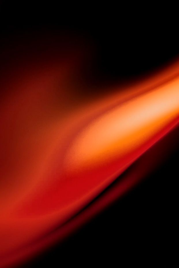 Artistic portrait with red and blue lighting creating a dramatic effect
