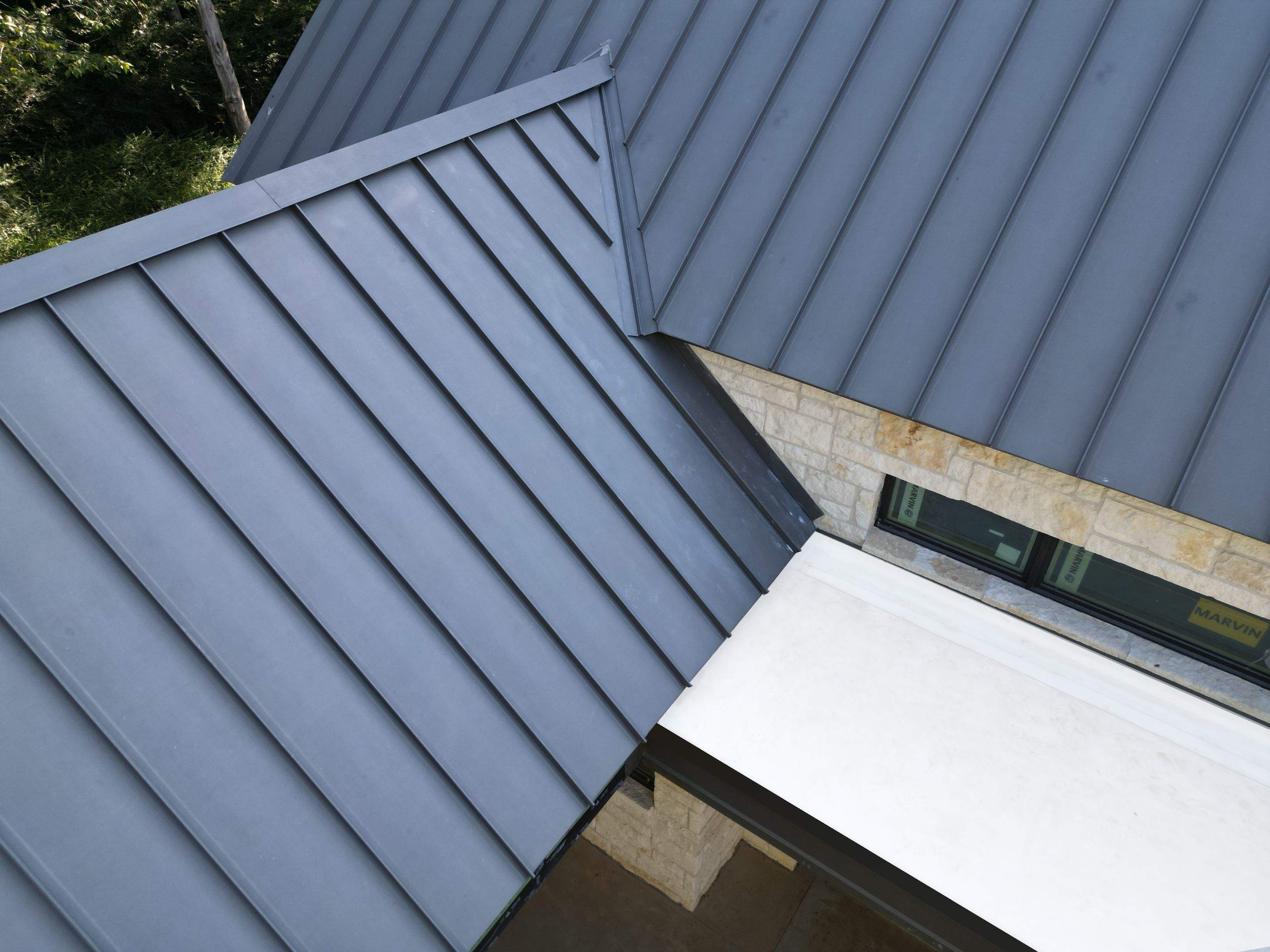Standing seam metal roof installation by Arrington Roofing Dallas roofing company