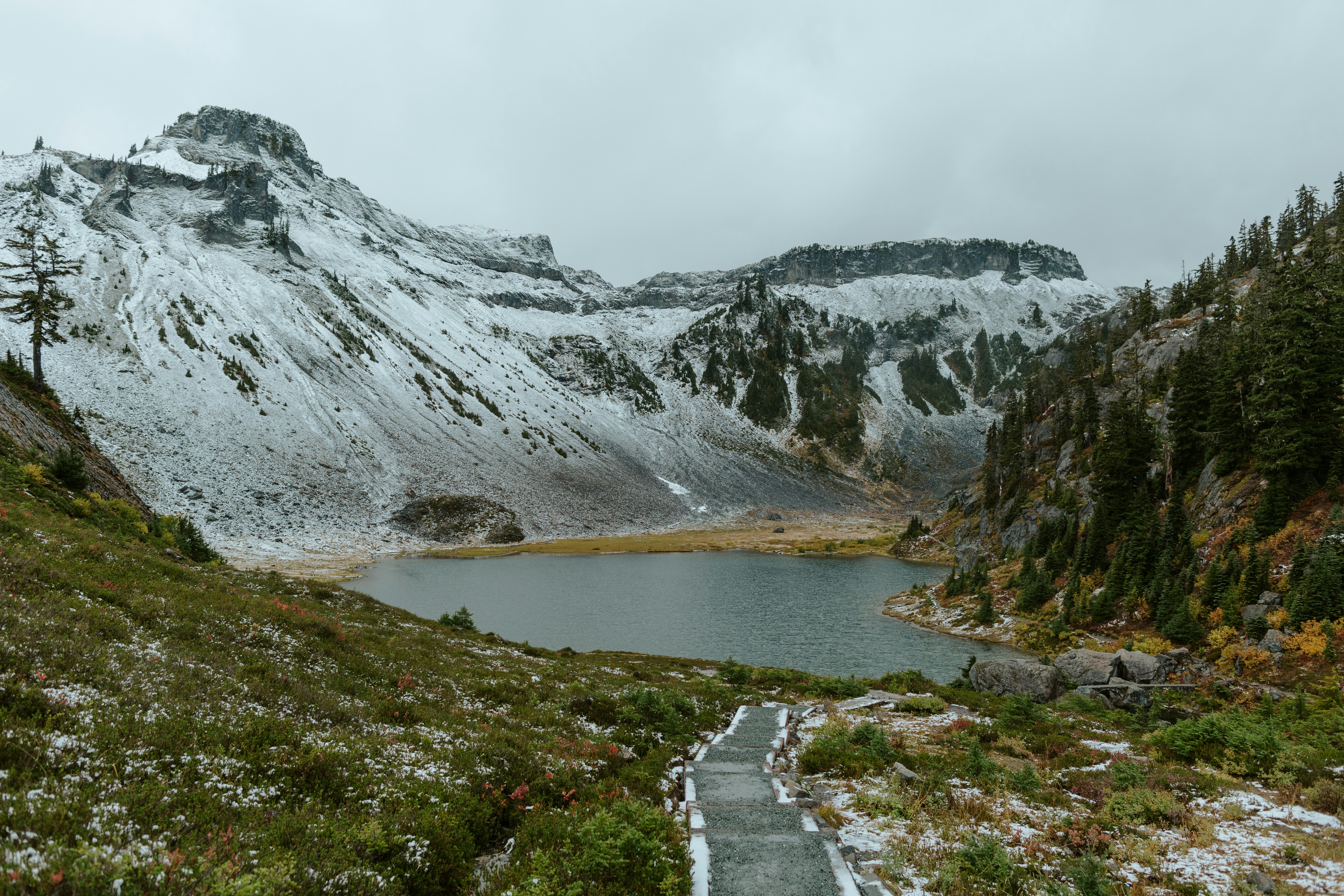 A path leading to a lake in the mountains