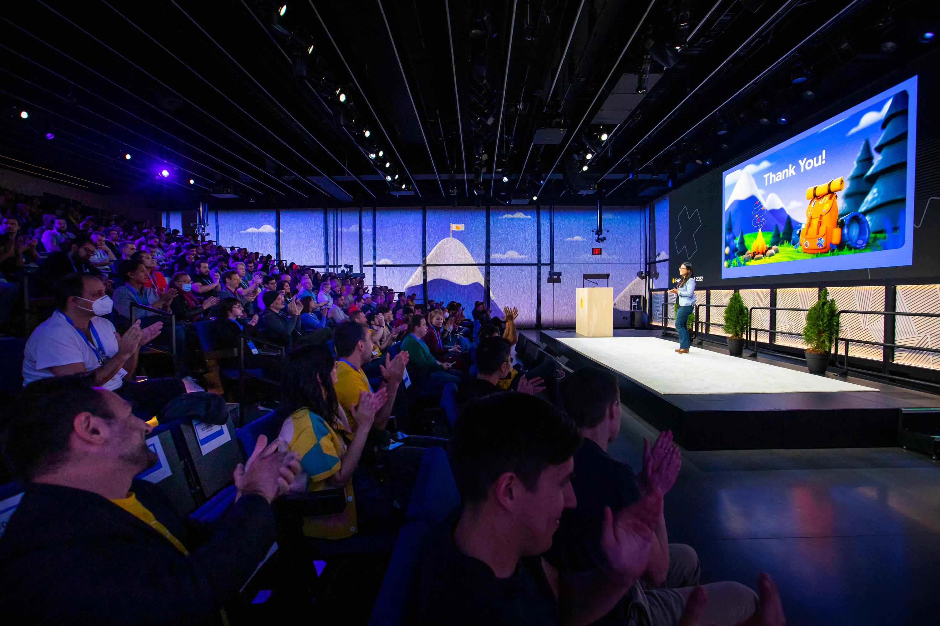 Attendees taking a photo with their Firebase plushies