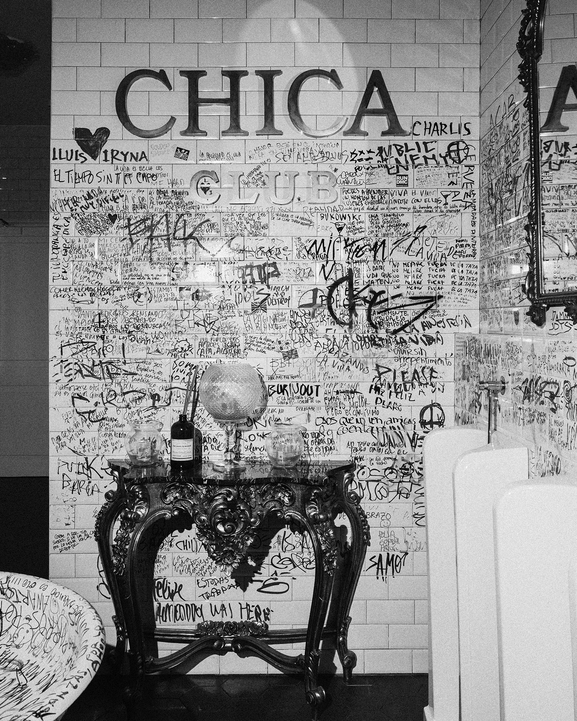 Streetside billboard with flyposters of the Batch.Works brand and illustrations