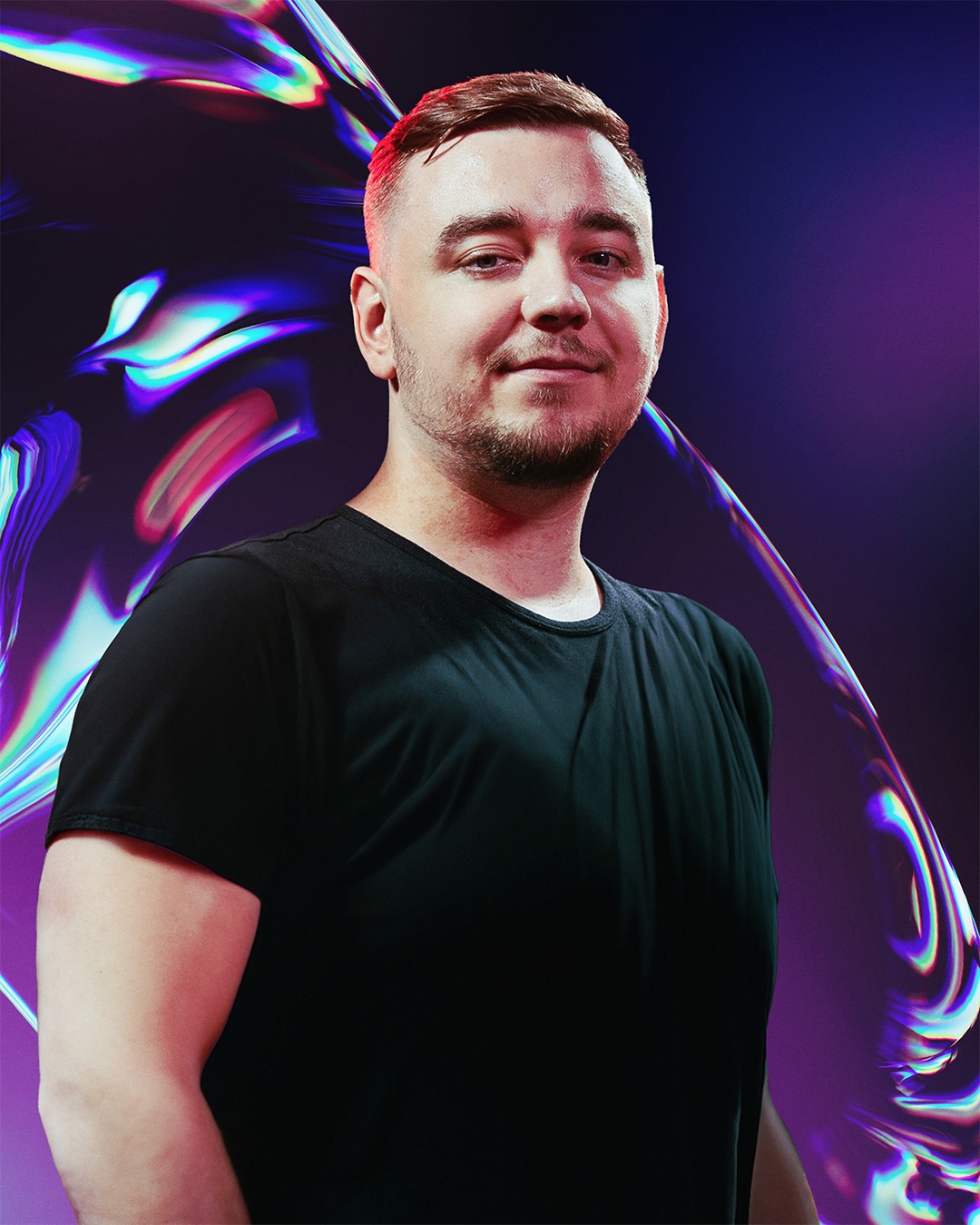 Portrait of a woman with long, smooth hair swept to the side, in a dark t-shirt, on a plain background.