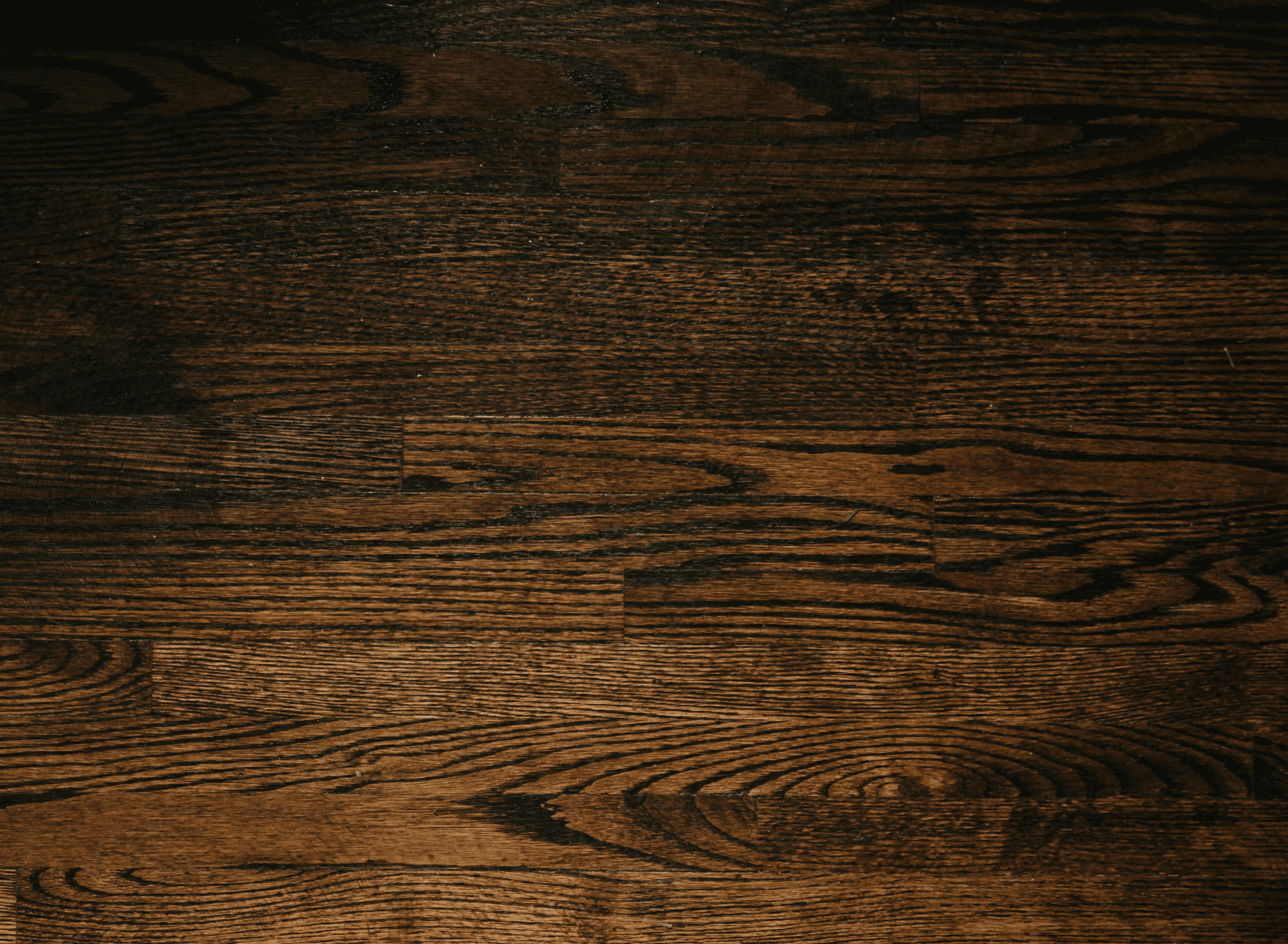 person sitting by the table opening book