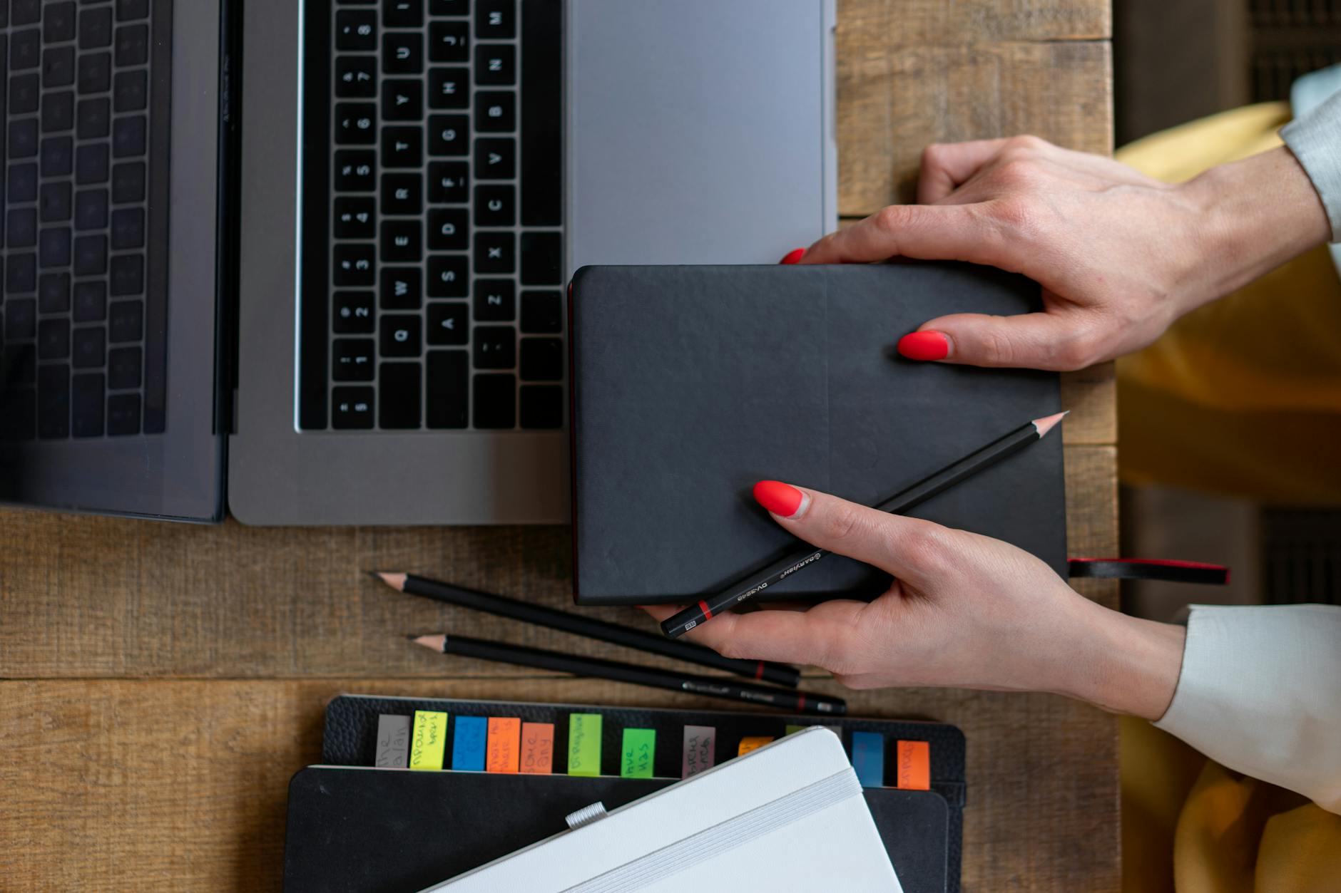 A school administrator using a digital tablet to record observations during a live classroom lesson.
