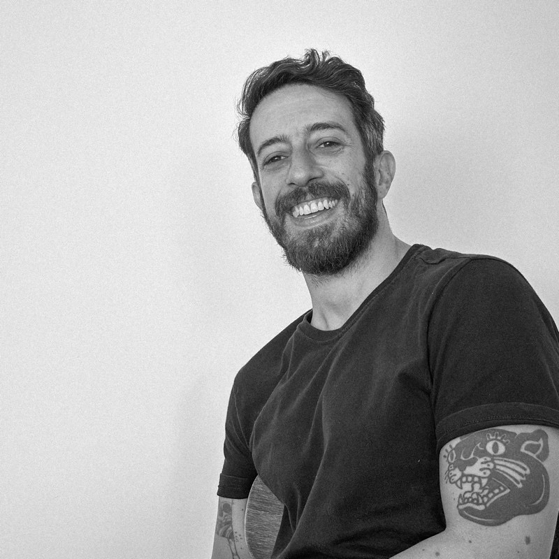 woman in black long sleeve shirt sitting on white couch