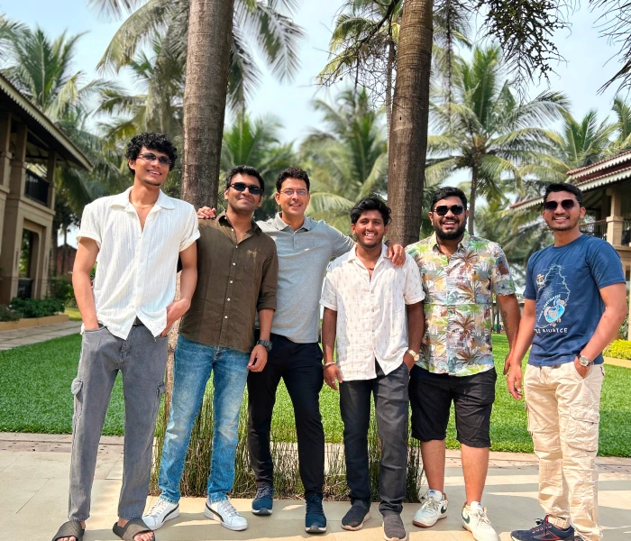 The image is from Instalogic, business intelligence, showing employees smiling outdoors.