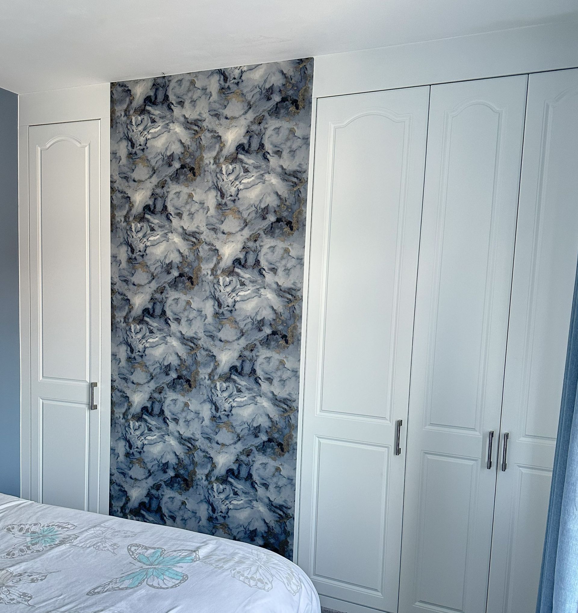 two sleek, wall-integrated wardrobes