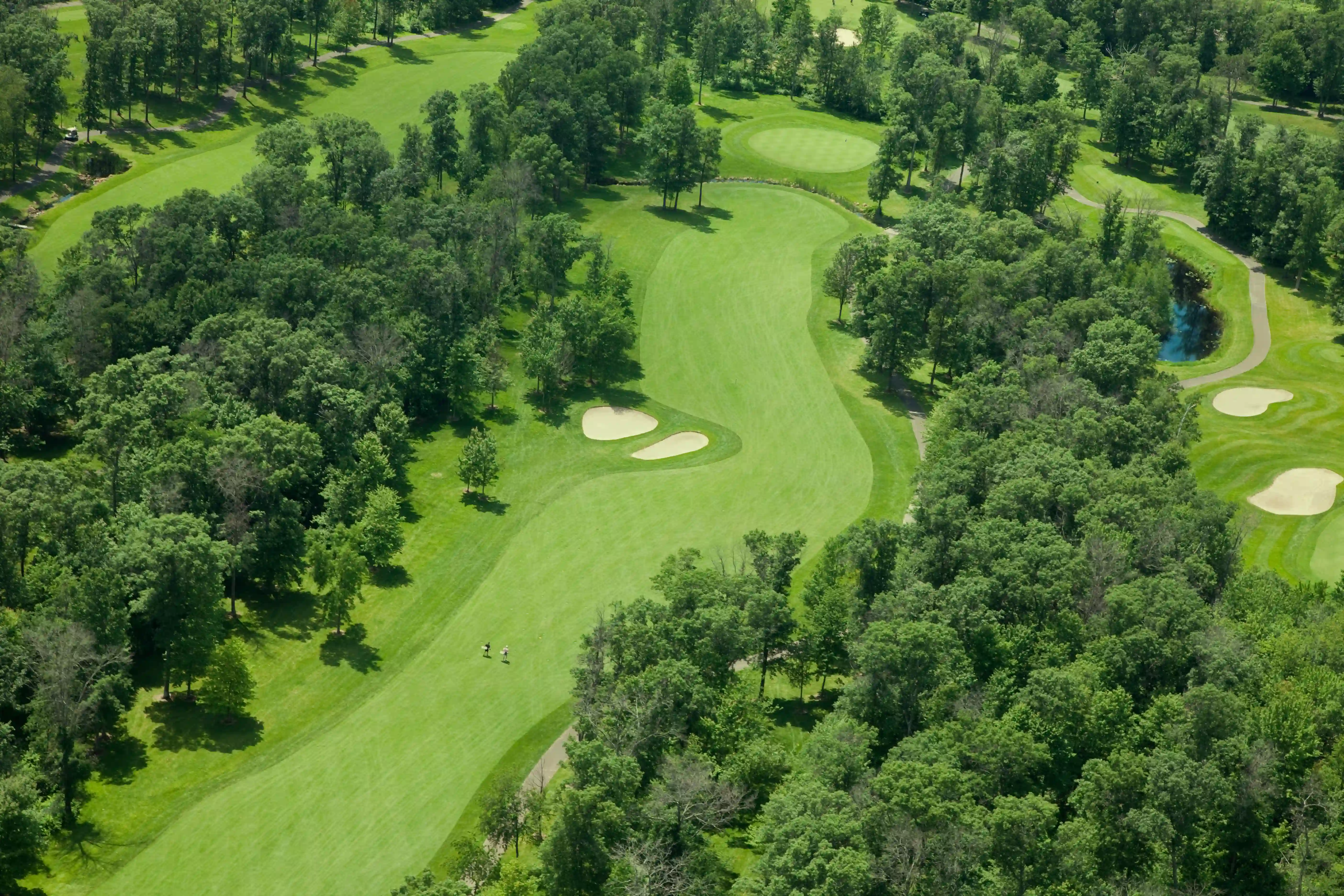 aerial photography of person trimming sports field during day
