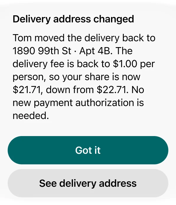 Alert: delivery address changed. Tom moved the delivery back, the delivery fee is back to $1.00 per person, and your share is down from $22.71 to $21.71; no new payment authorization is needed. Buttons Got it and See delivery address.