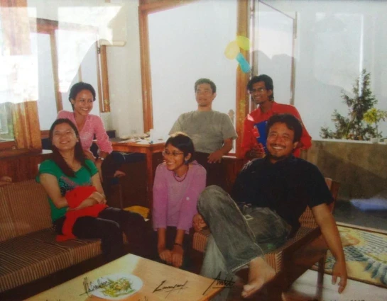 person sitting in a chair in front of a man