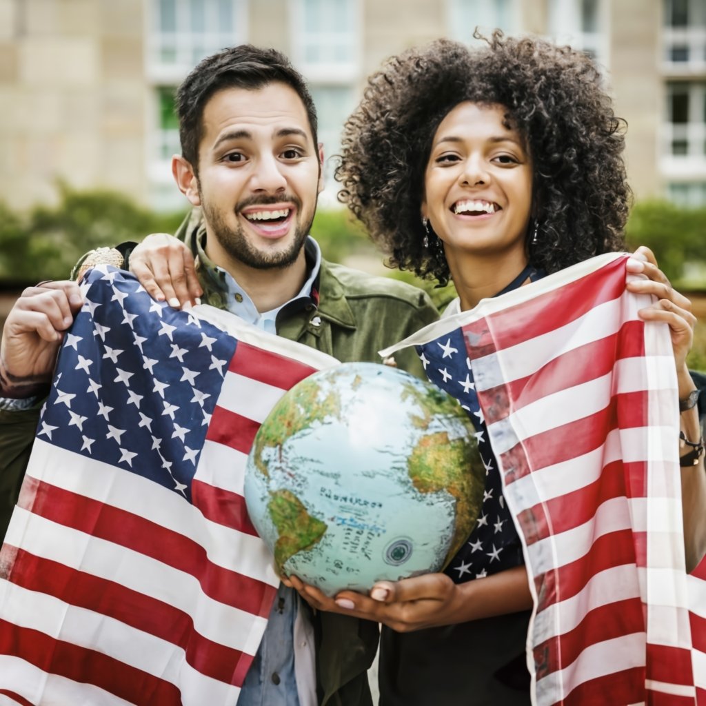 A joyful, multicultural couple embracing each other while holding a U.S. flag and a globe. The background features a blend of cultural symbols, highlighting their international marriage and the global journey they are on together with the K3 Visa.