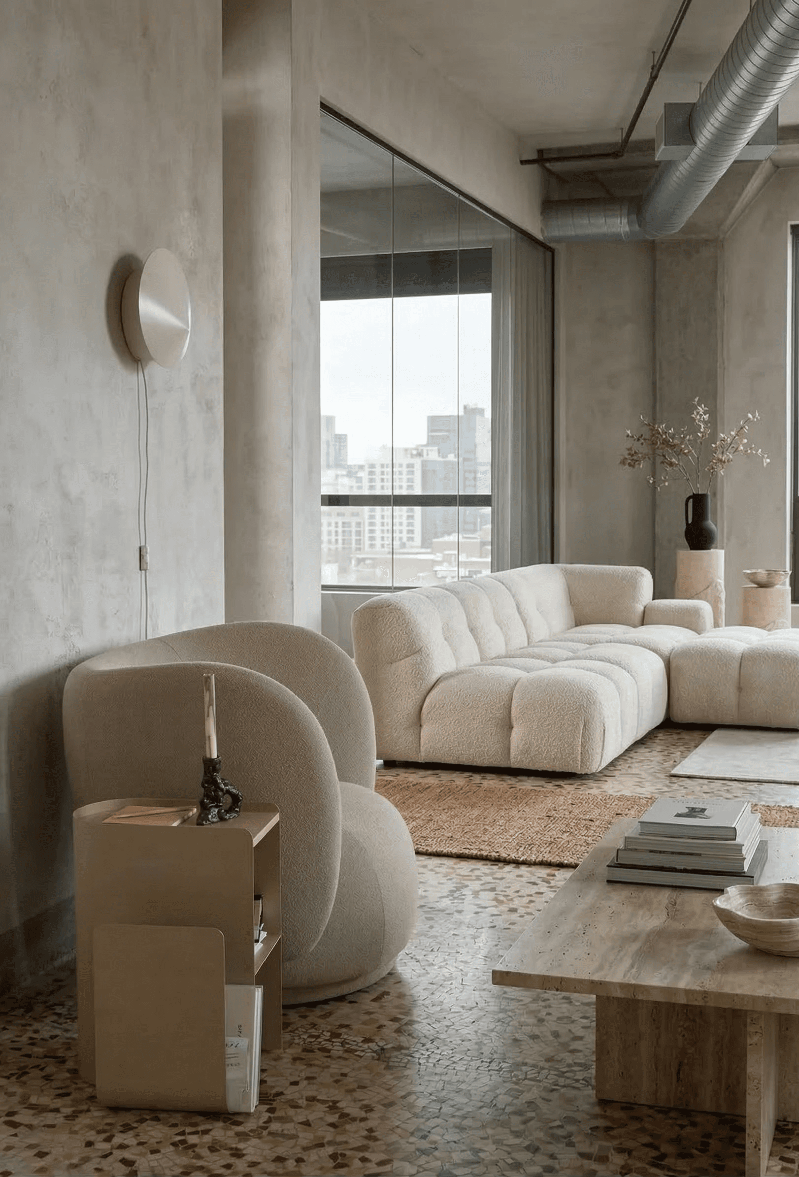 Contemporary interior with sculpted angled walls and a skylight filling the space with natural light.