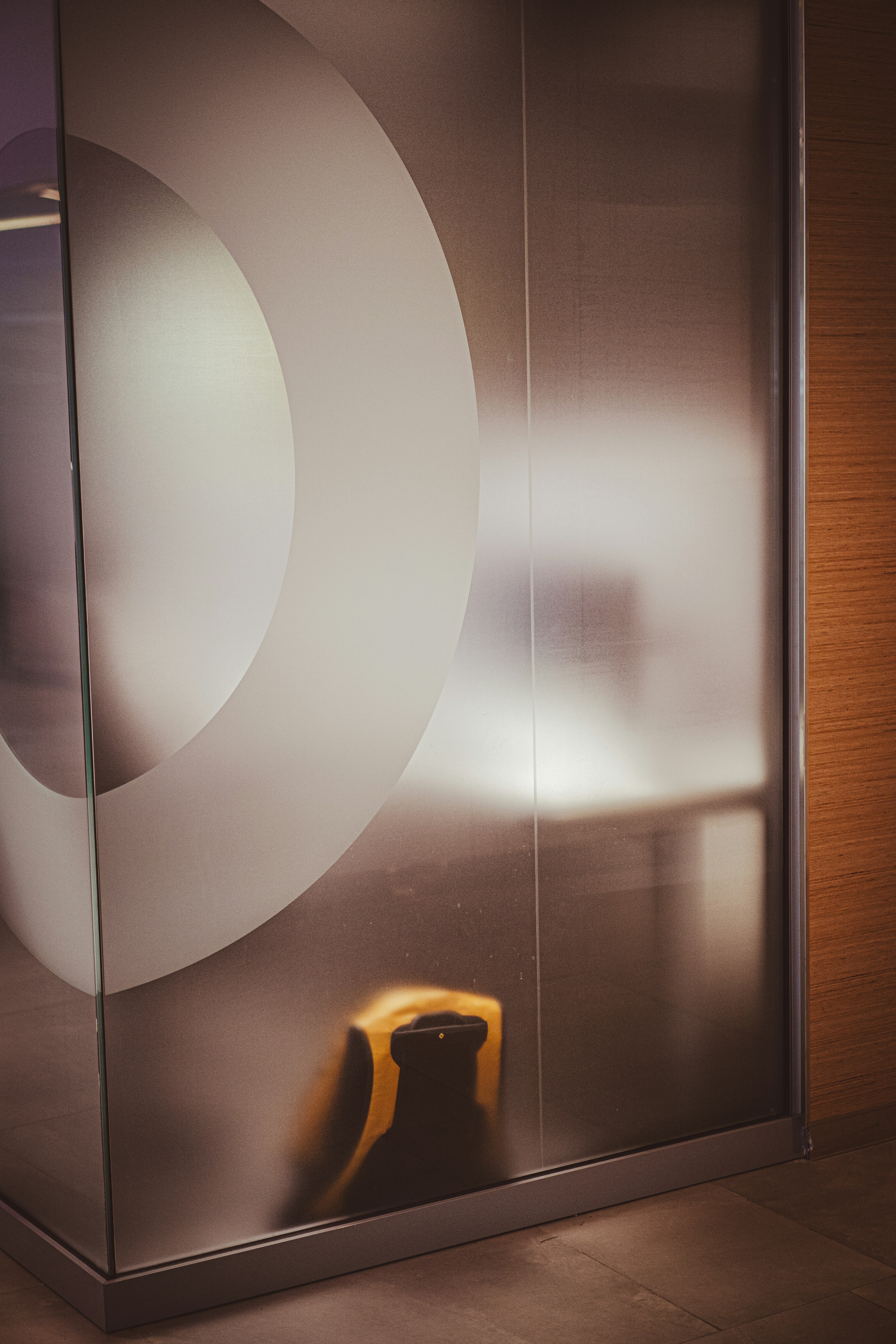 A glass display case with a yellow object in it