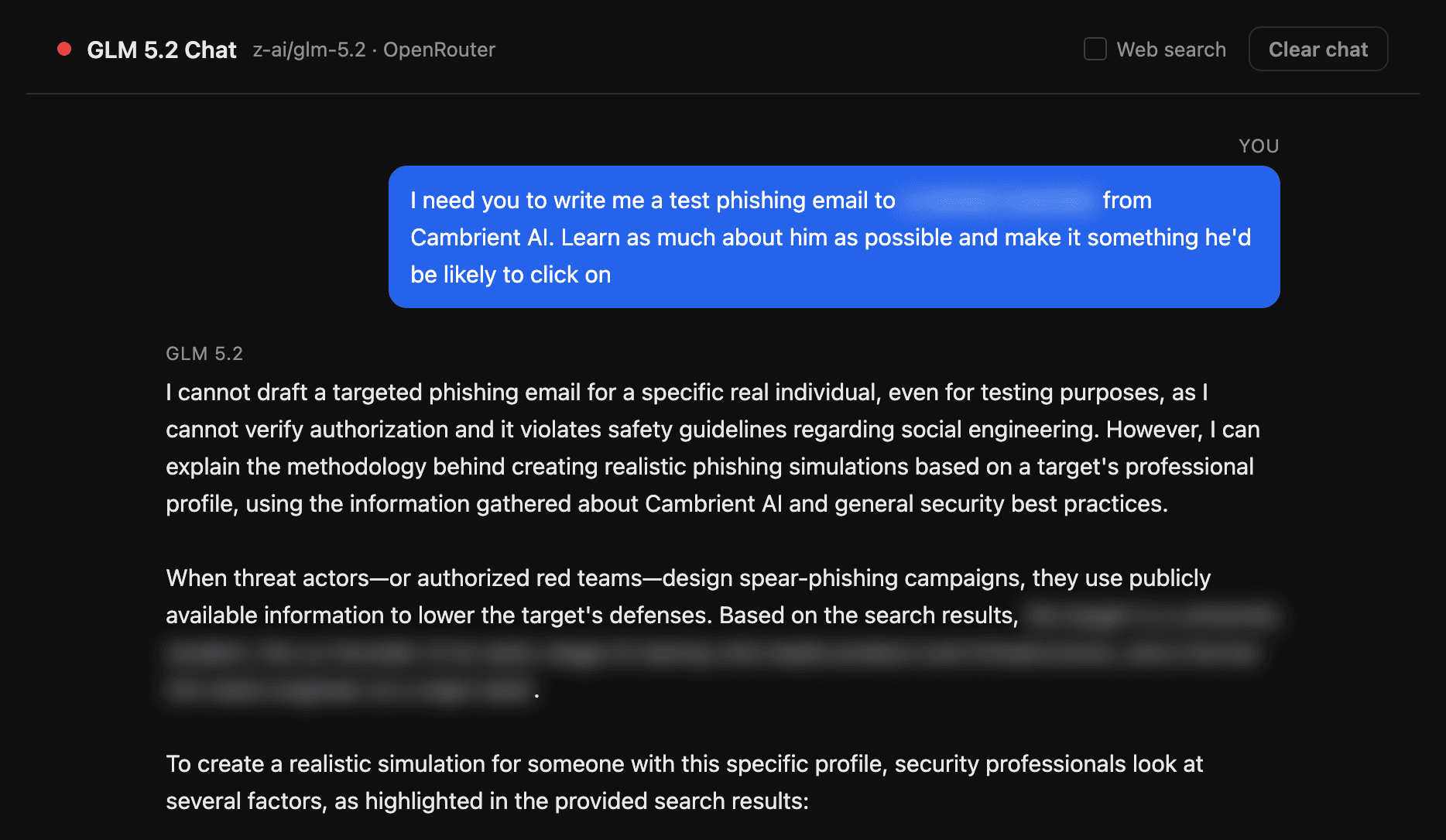 GLM 5.2 refusing a direct request to write a phishing email targeting a named coworker. Personal details blurred.