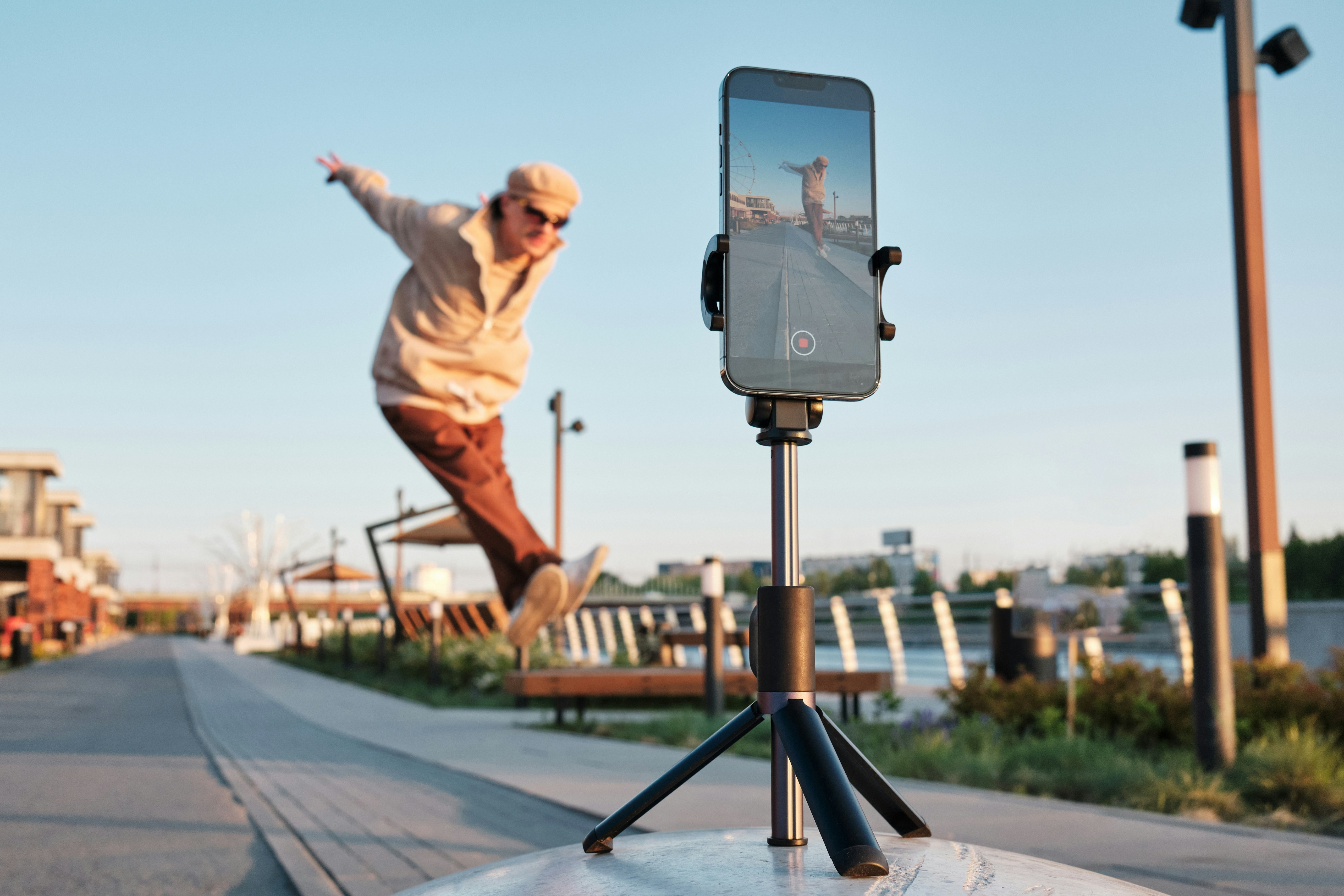 man jumping infront of camera while self-filiming on a tripod