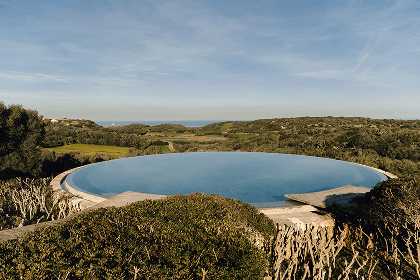 two lounge chairs near swimming pool