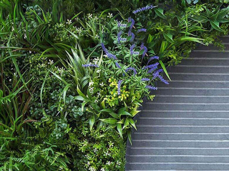 This swatch of Vistafolia's year-round artificial green wall is customized with Color Box selections of Soft Lavender, Delicate White, Forest Flame, or Spring Pink.