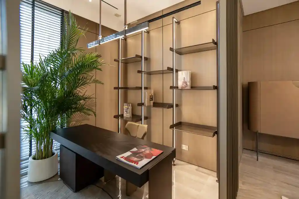 Study/office area with a display unit and a chandelier.