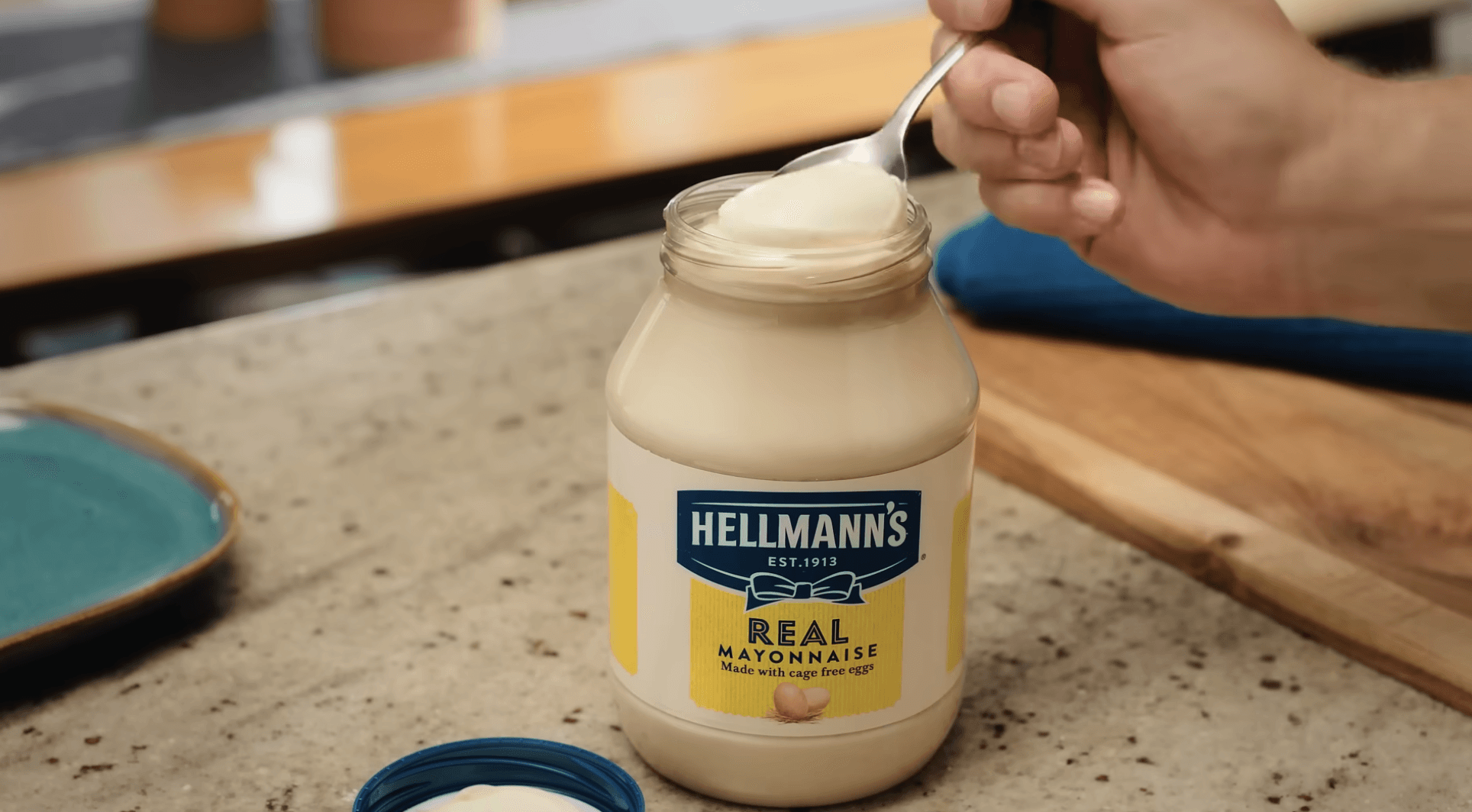 a hellman bottle with spoon dipped inside
