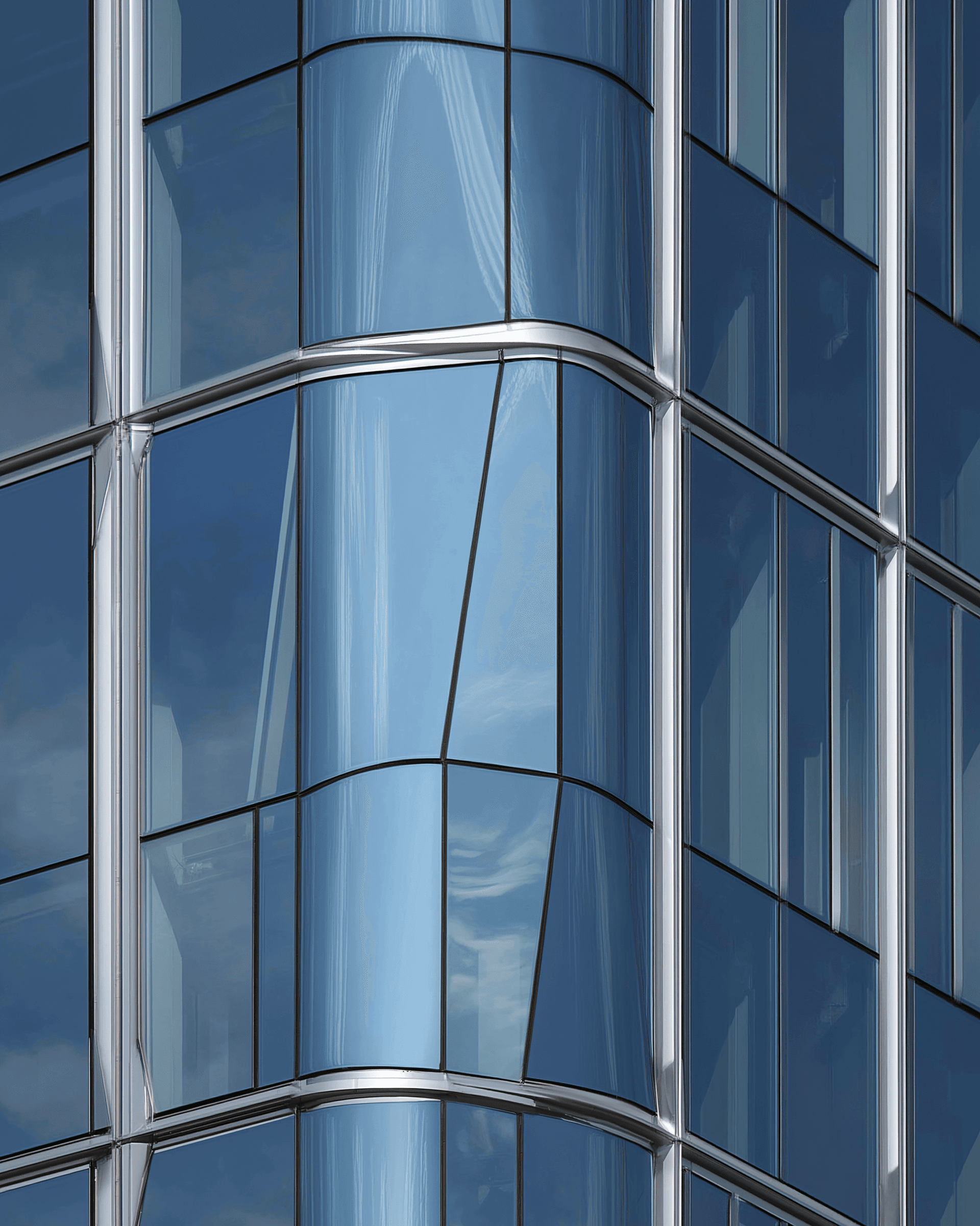 A modern restaurant with a teal coffered ceiling, white curtains, large windows, dark leather chairs, wooden tables, and a white dome lamp on a marble counter.