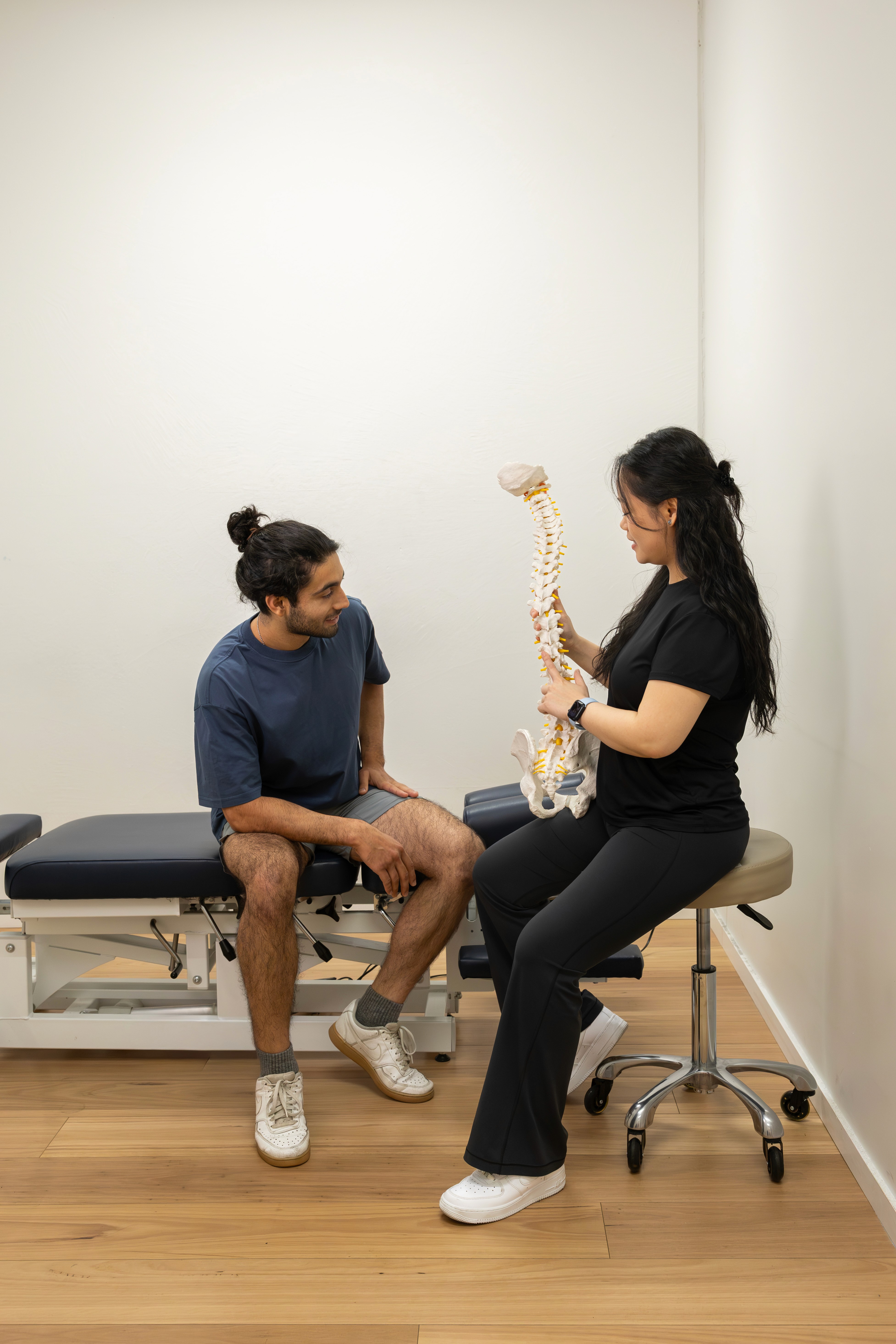 a woman getting a back massage from a man