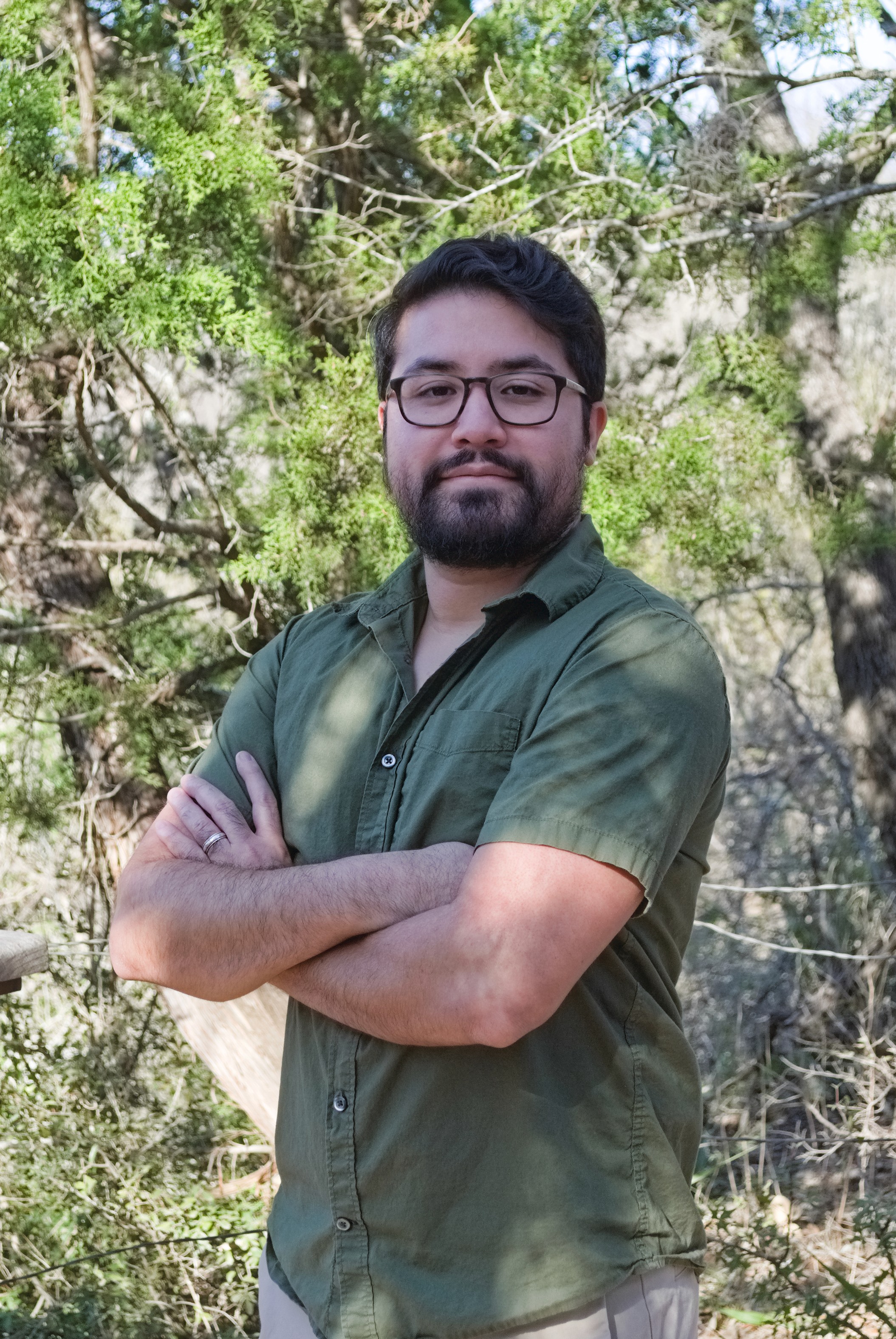 Jozabad facing camera with trees and foliage in background